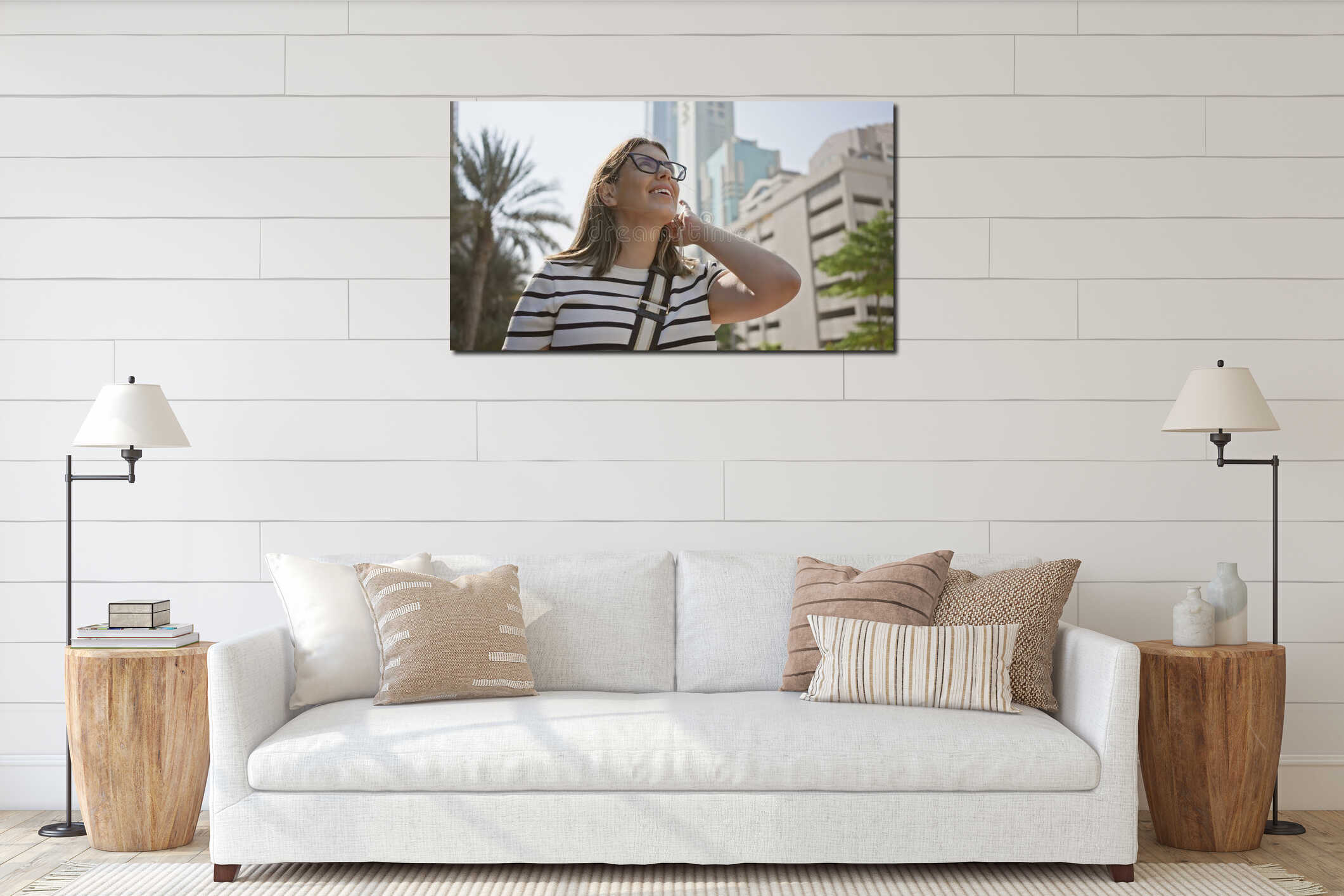 A smiling young woman with glasses enjoys the sunny urban landscape of dubai amid modern skyscrapers interior mockup