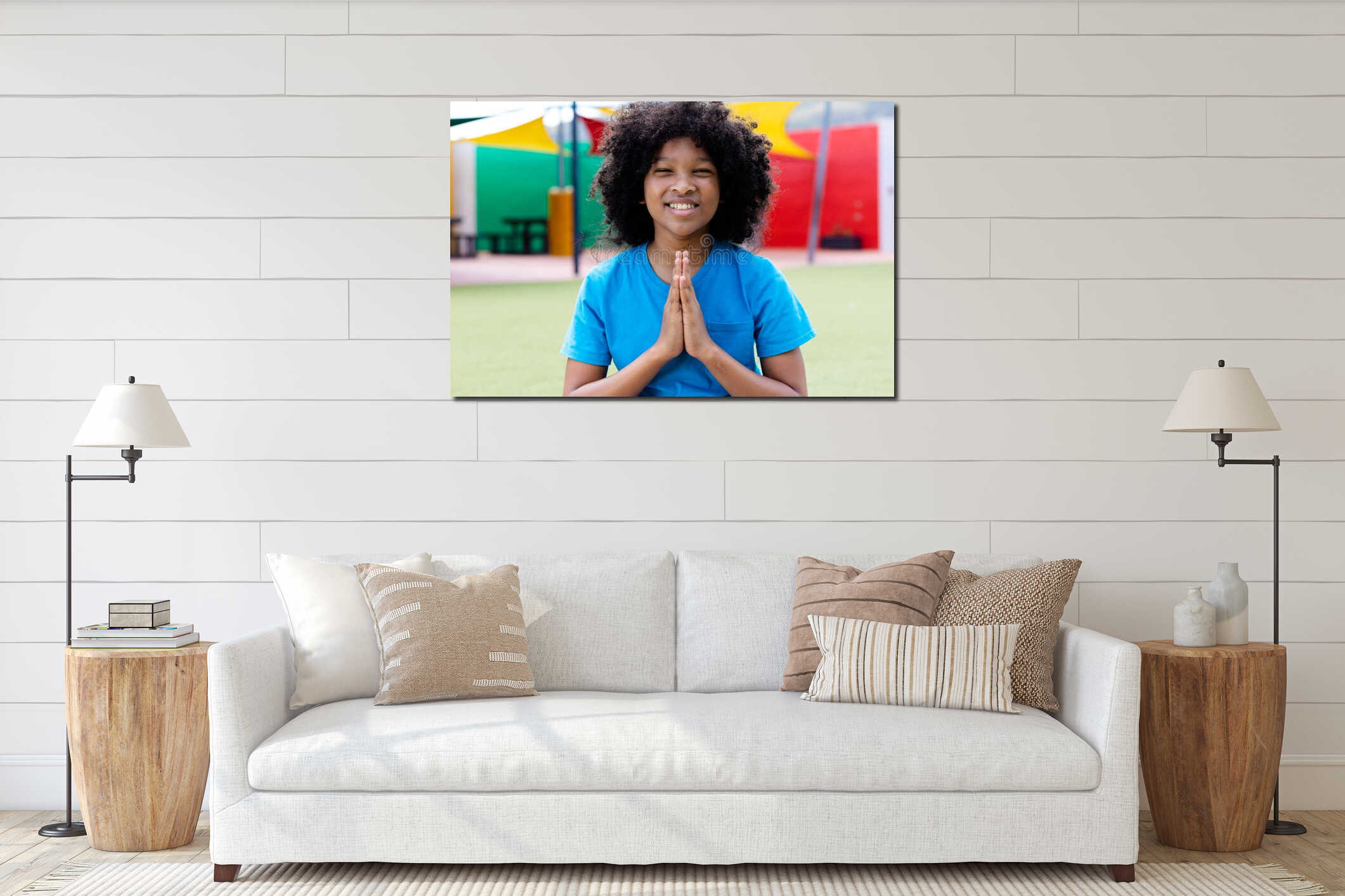Portrait of smiling biracial schoolgirl practicing yoga meditation in schoolyard, with copy space interior mockup