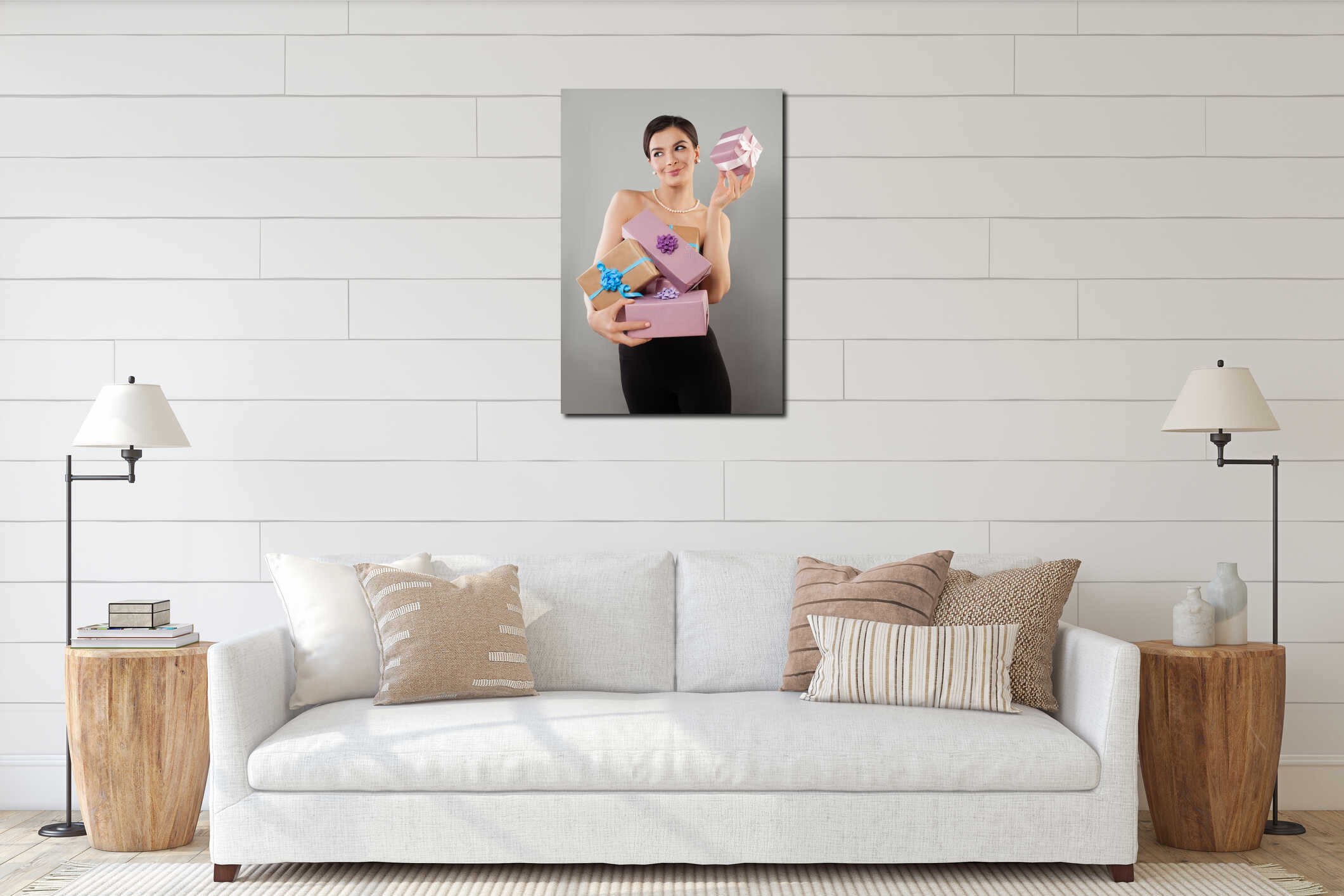 Gorgeous positive young adult model woman posing showing pink and beige present gift box on gray background interior mockup
