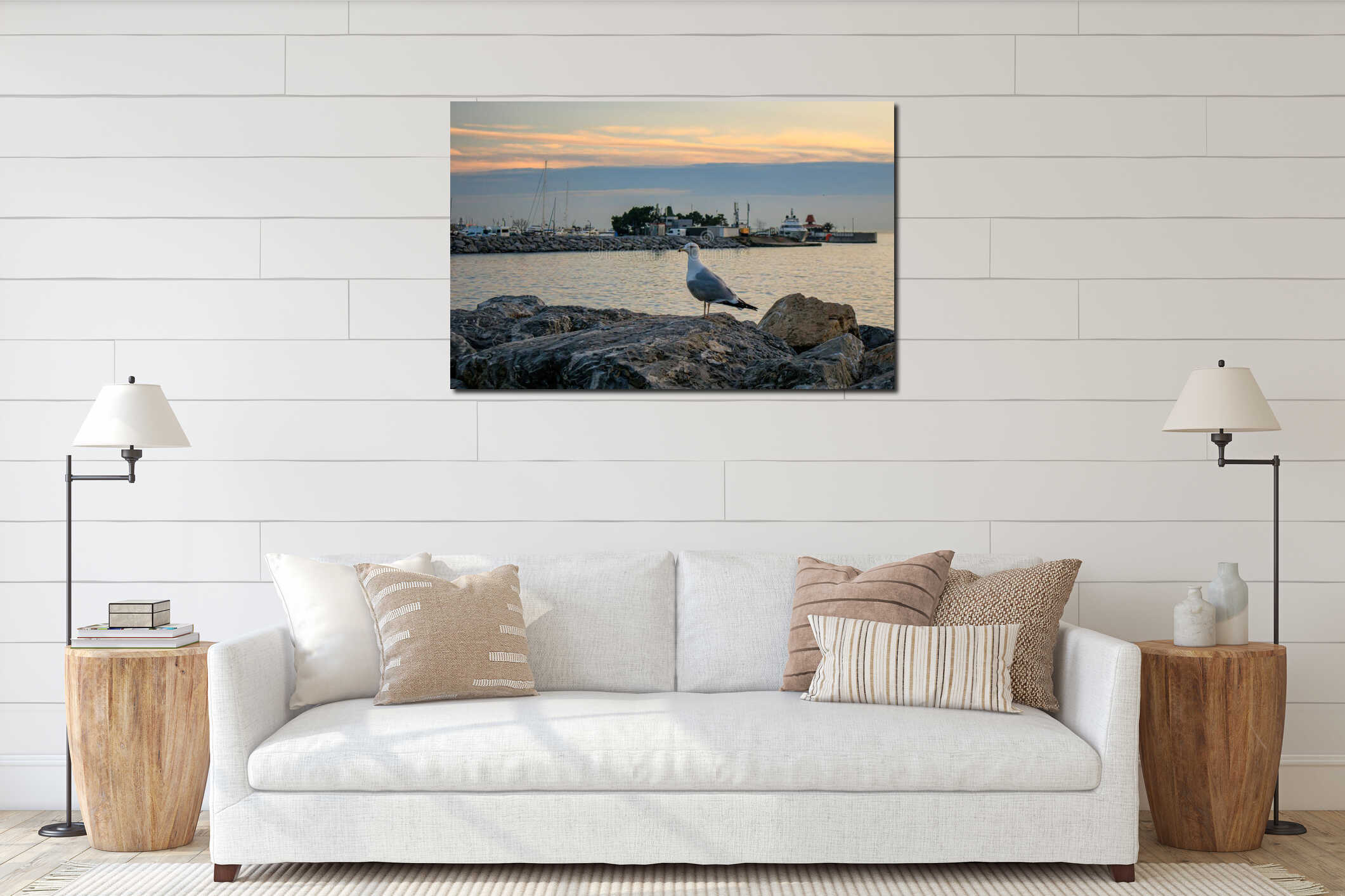 Seagull standing on the beach rocks in the front of harbor interior mockup