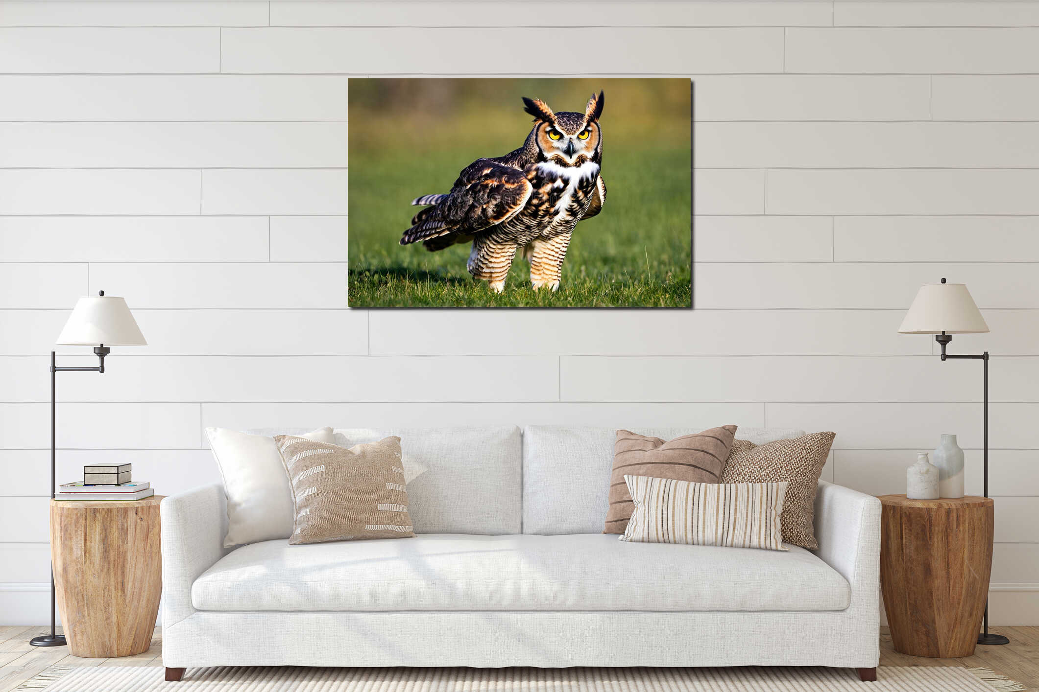 Brown eagle owl in the grass, natural blurred background. interior mockup