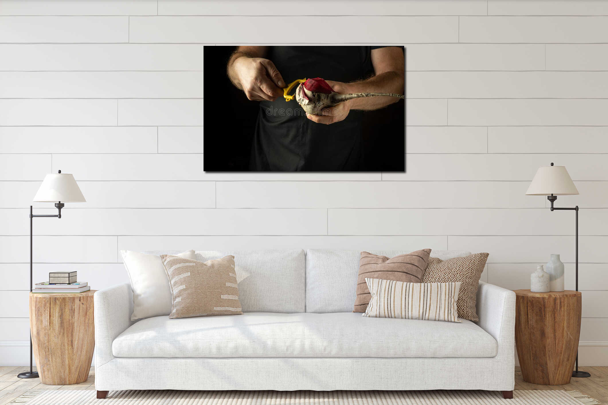 A cook peels beetroot for grilling or cooking vegetable dishes. Close-up of a chef hands on a black background using a vegetable interior mockup