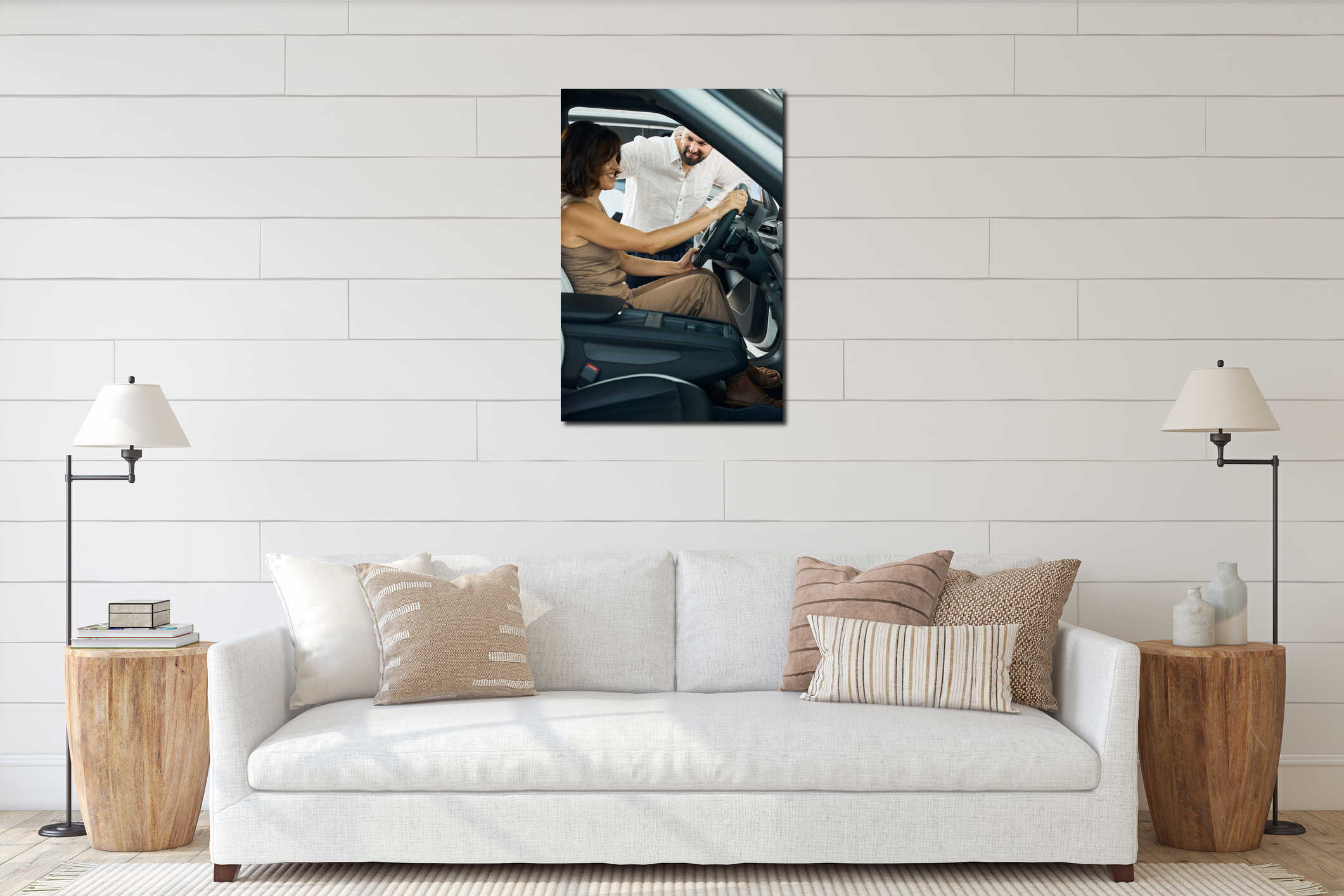 Beautiful young couple sitting at the front seat of the car interior mockup