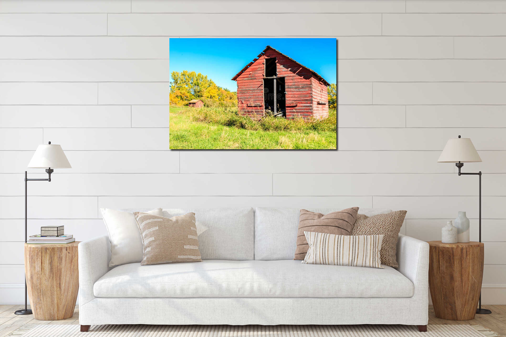 A red barn with a large open doorway sits in a grassy field interior mockup