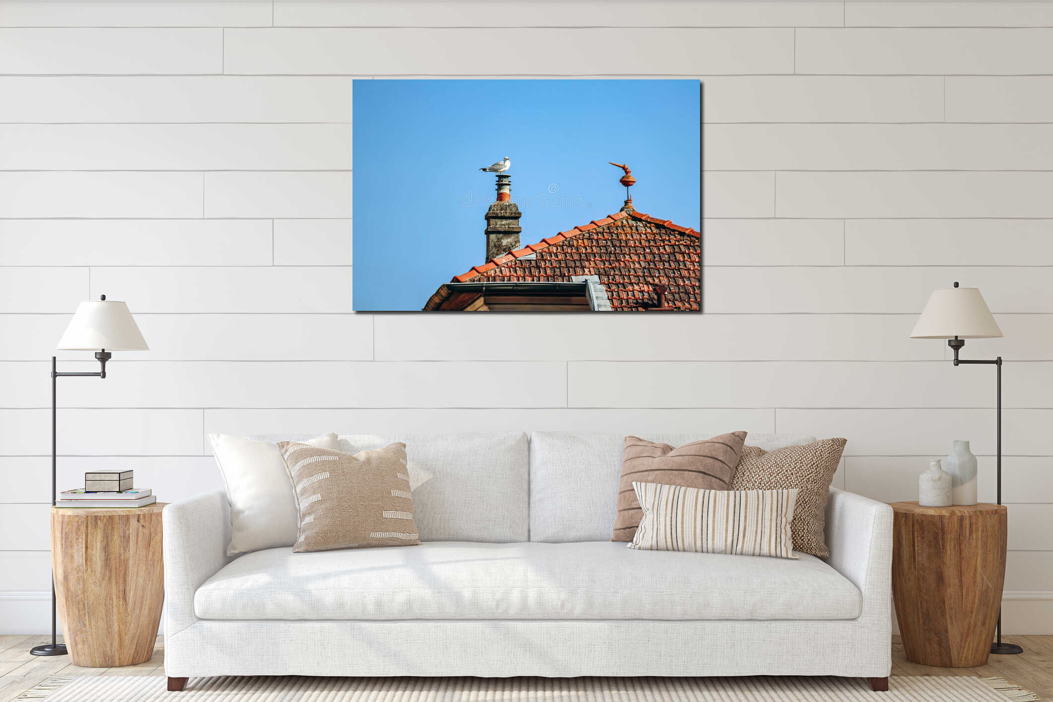 A seagull sits on a chimney, next to a red tiled roof interior mockup
