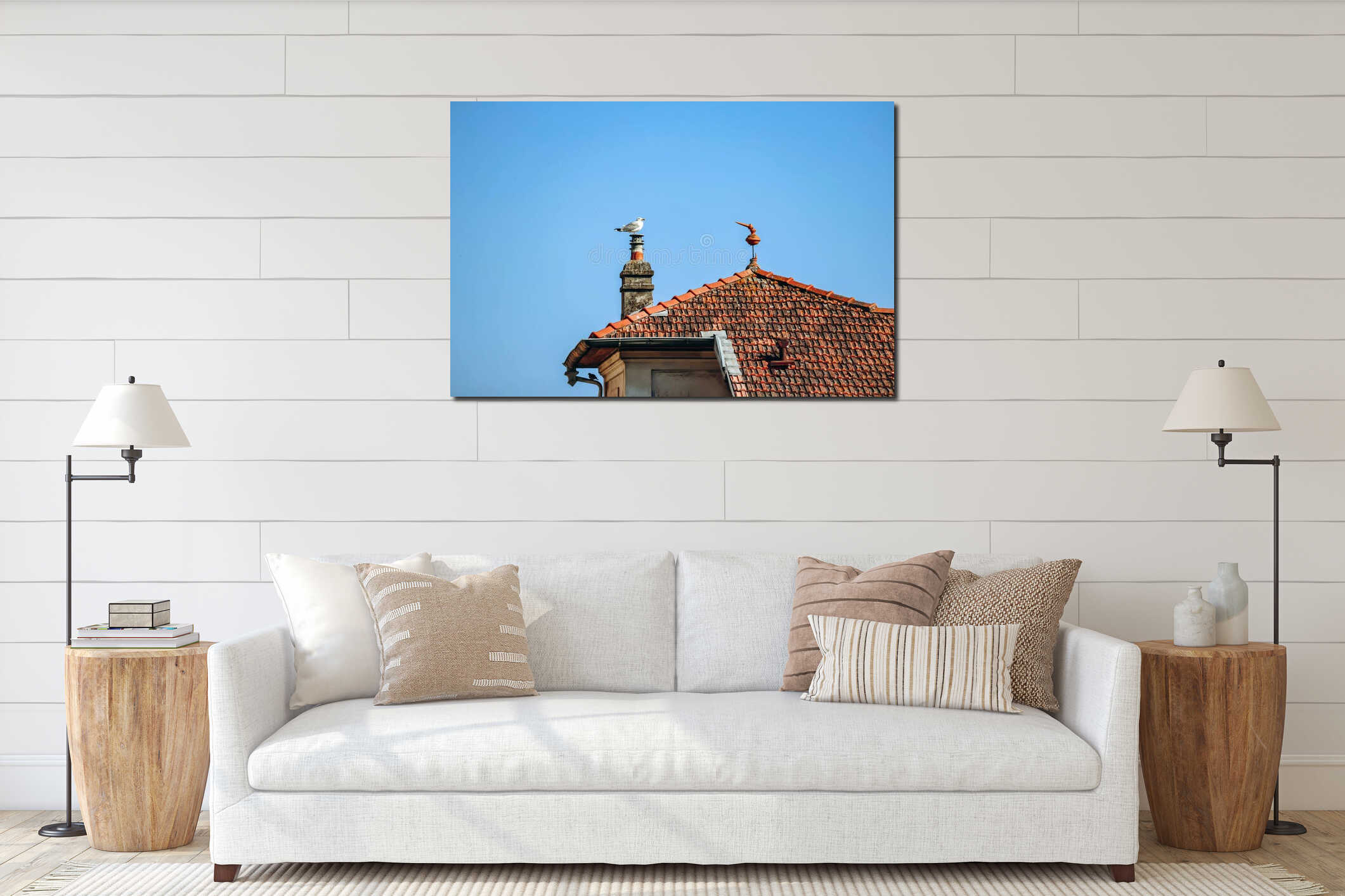 A seagull sits on a chimney, next to a red tiled roof interior mockup