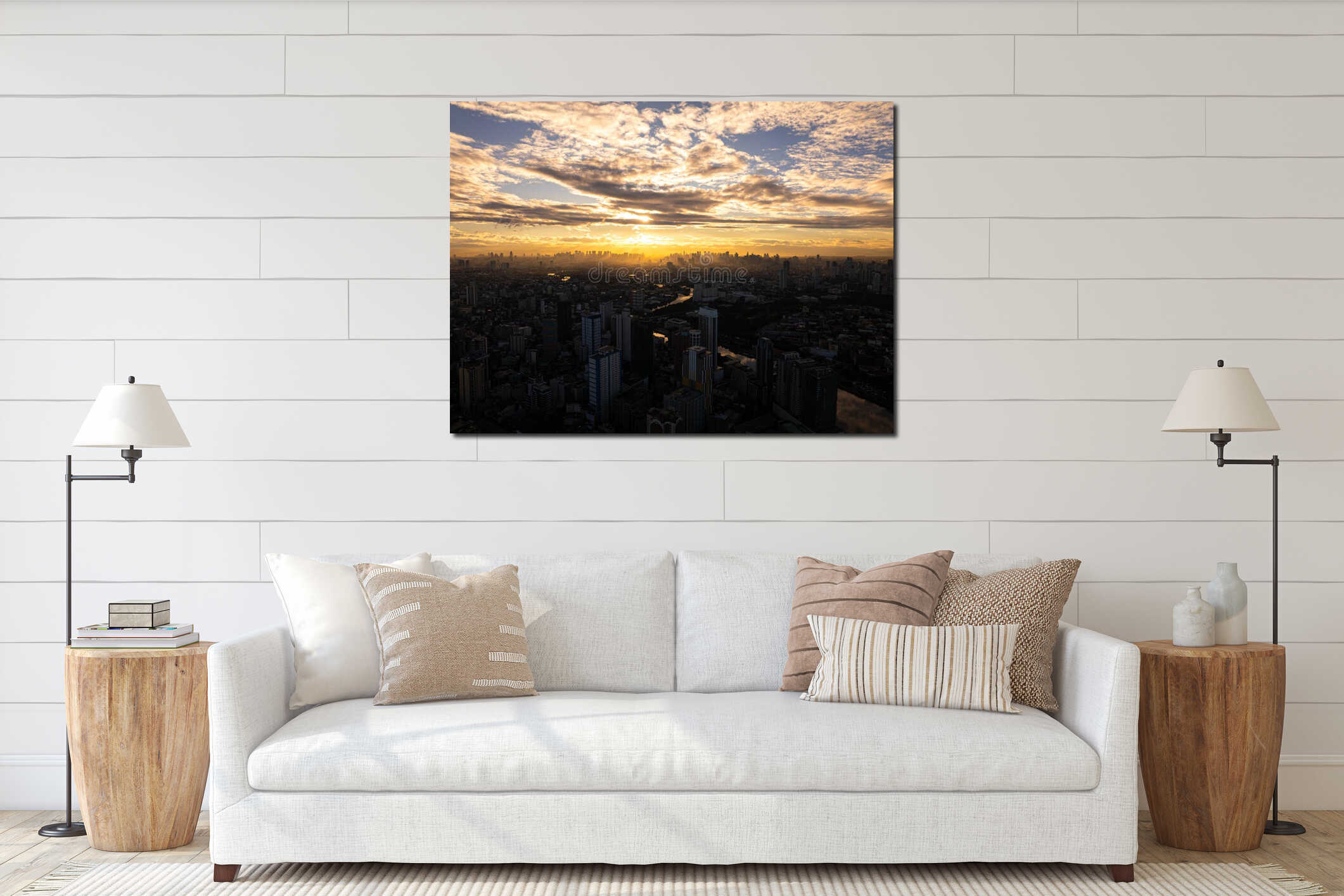 Manila city skyline with skyscrapers and buildings glowing in the golden sunset with clouds and sunbeams. Aerial view of interior mockup