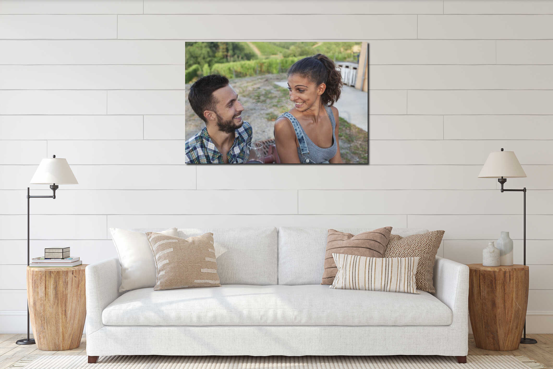 portrait of young couple of winemakers toasting with two glasses of wine sitting on an old tractor at sunset interior mockup
