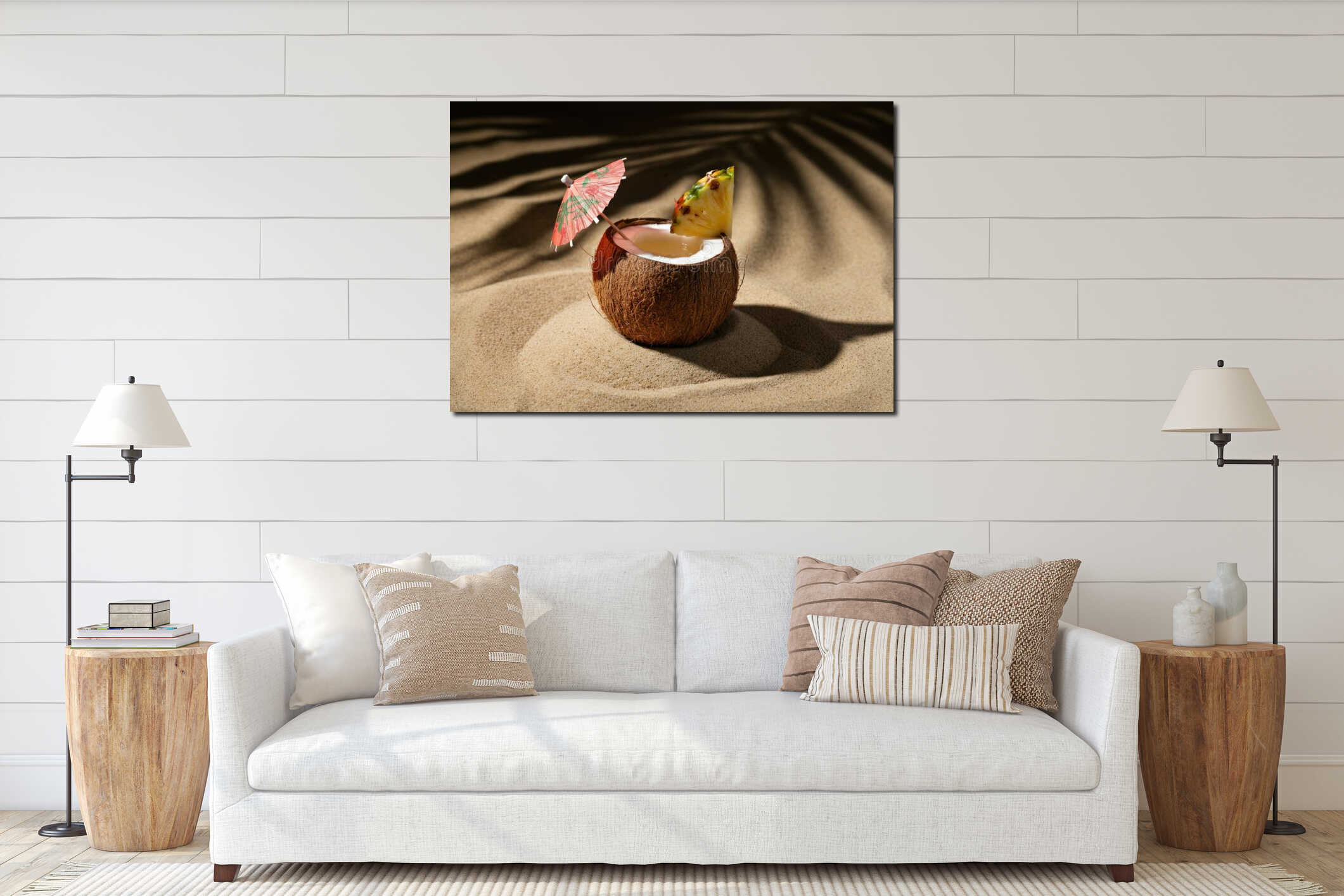 Tropical coconut cocktail with pineapple and umbrella on sandy beach interior mockup
