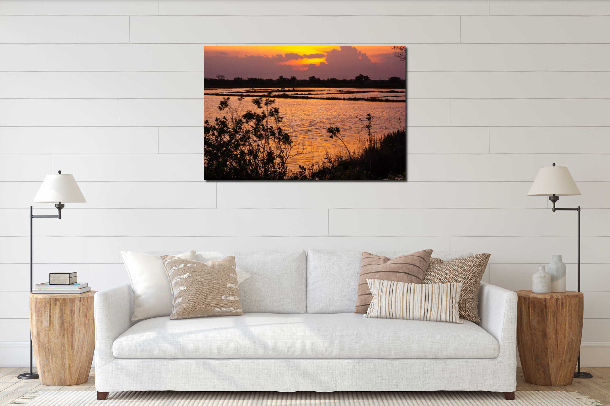 Golden sunset paints the sky and reflects on the tranquil water interior mockup