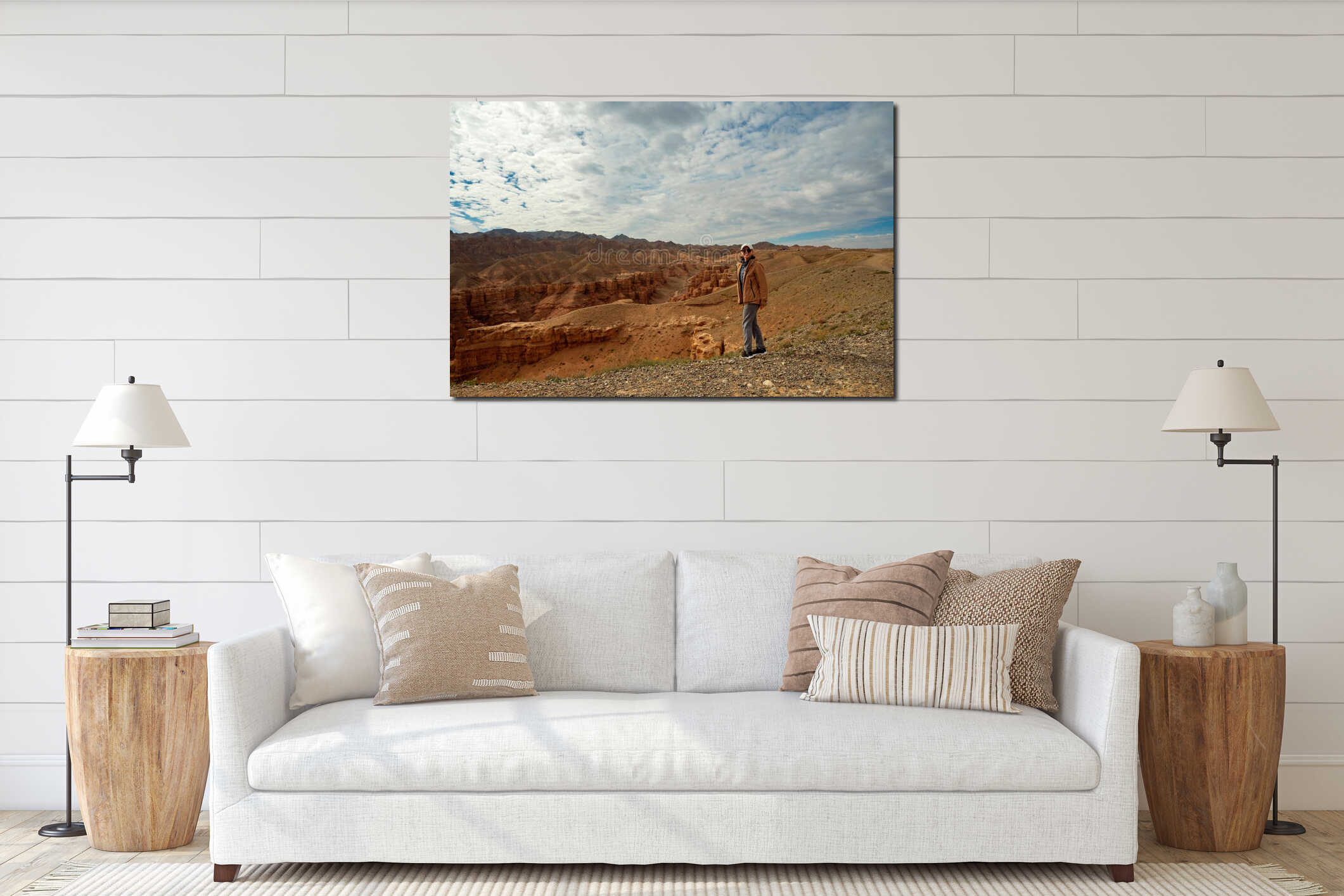 a female tourist looks at the camera and smiles against the backdrop of beautiful orange mountains canyons interior mockup
