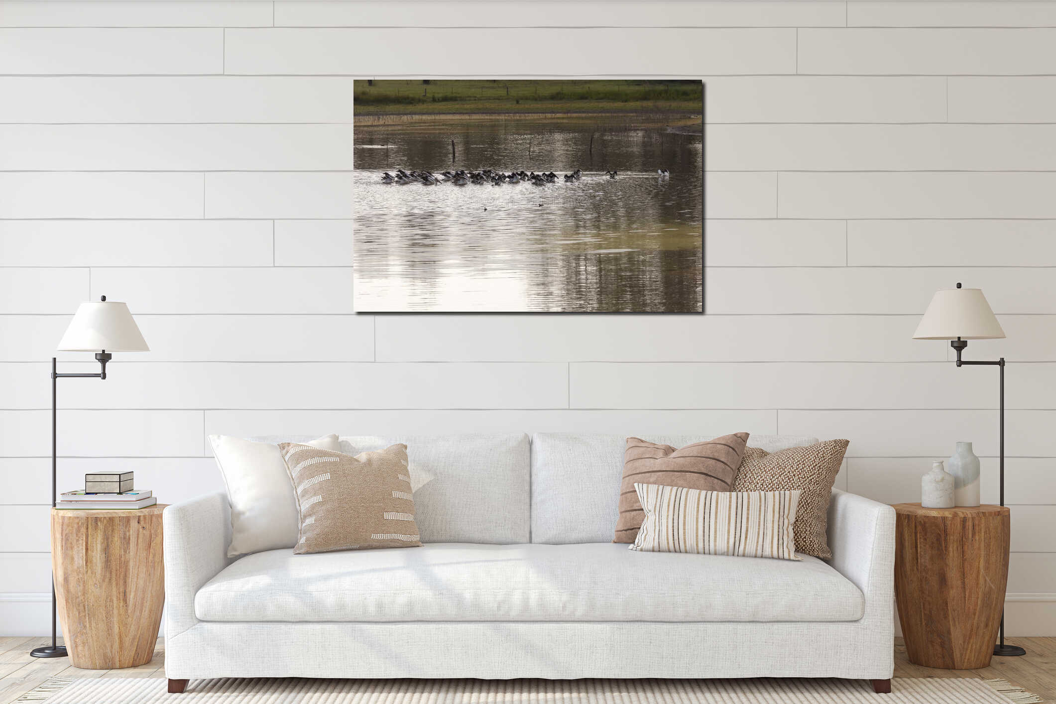 Pelicans feeding on a tranquil lake in a large meadow interior mockup