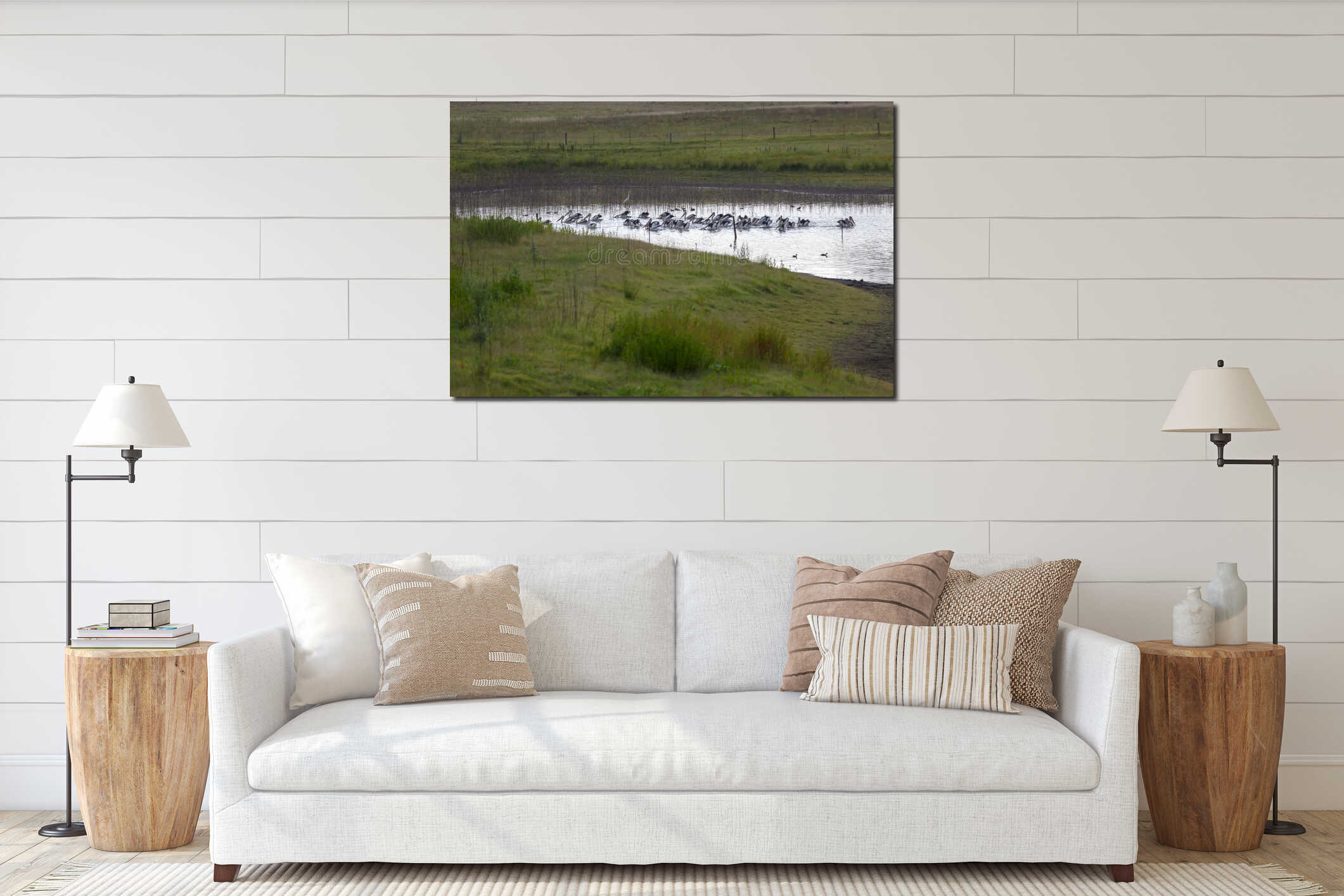 Pelicans feeding on a tranquil lake in a large meadow interior mockup