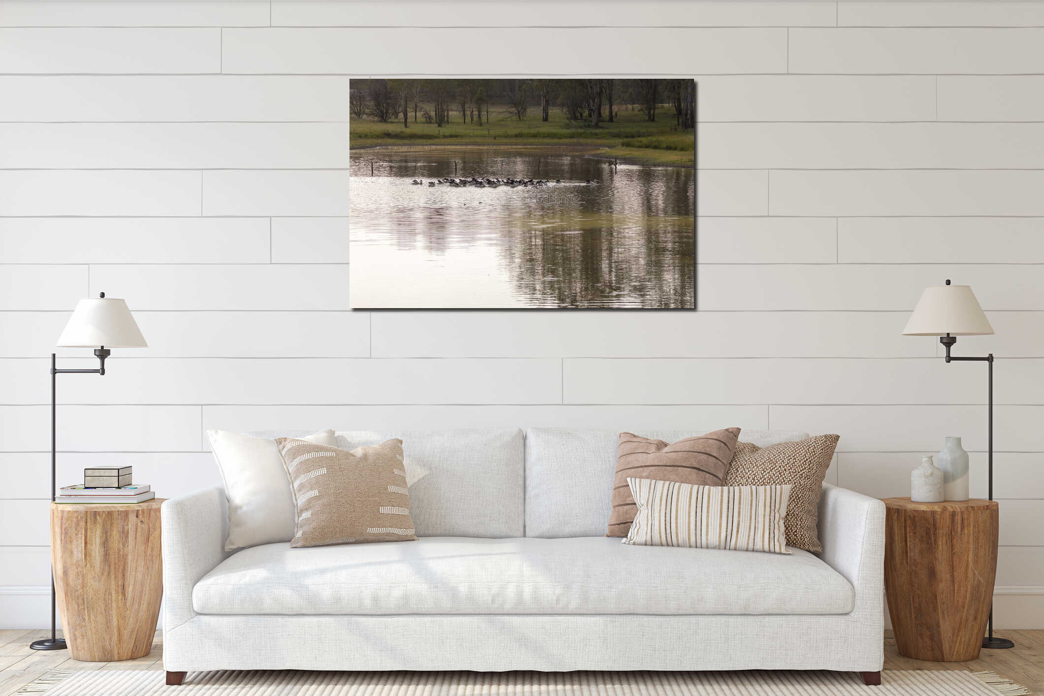 Pelicans feeding on a tranquil lake in a large meadow interior mockup