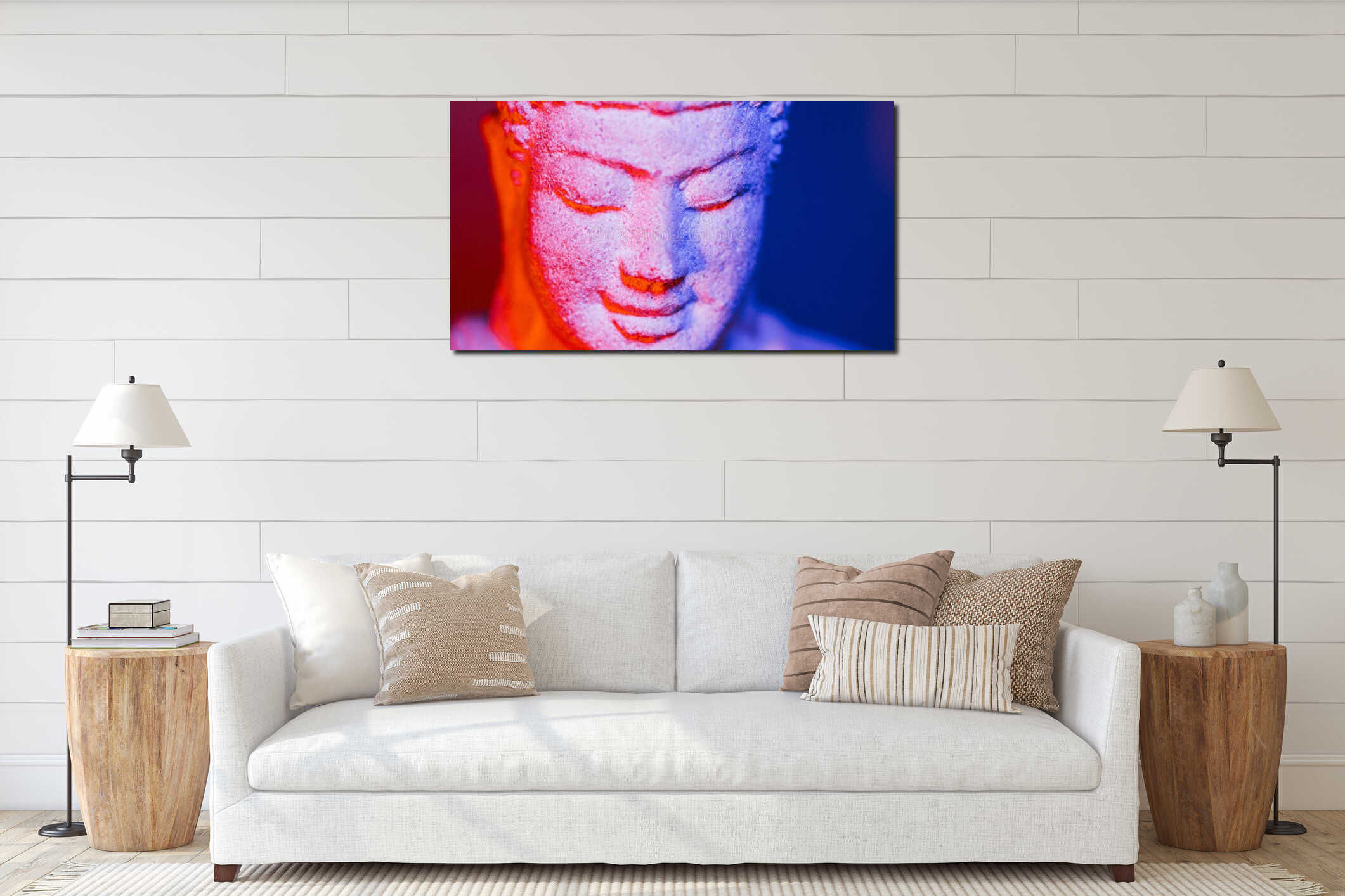 Close-up of a serene Buddha statue illuminated with vibrant red and blue lighting interior mockup