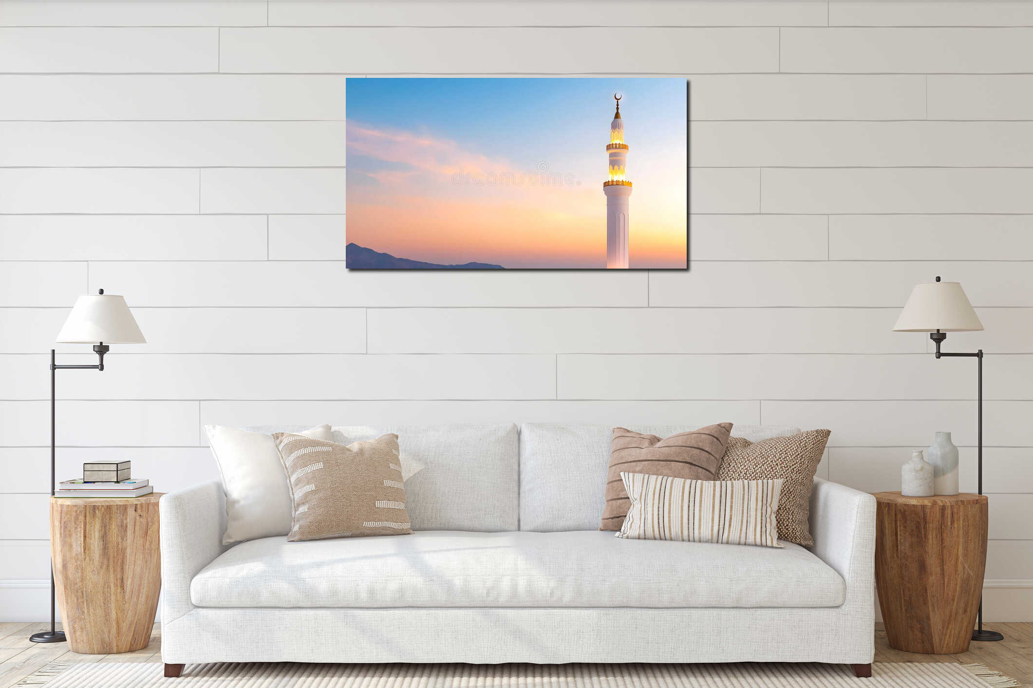 Elegant illuminated mosque minaret standing against a peaceful sunset sky with soft pastel clouds. Perfect for islamic interior mockup