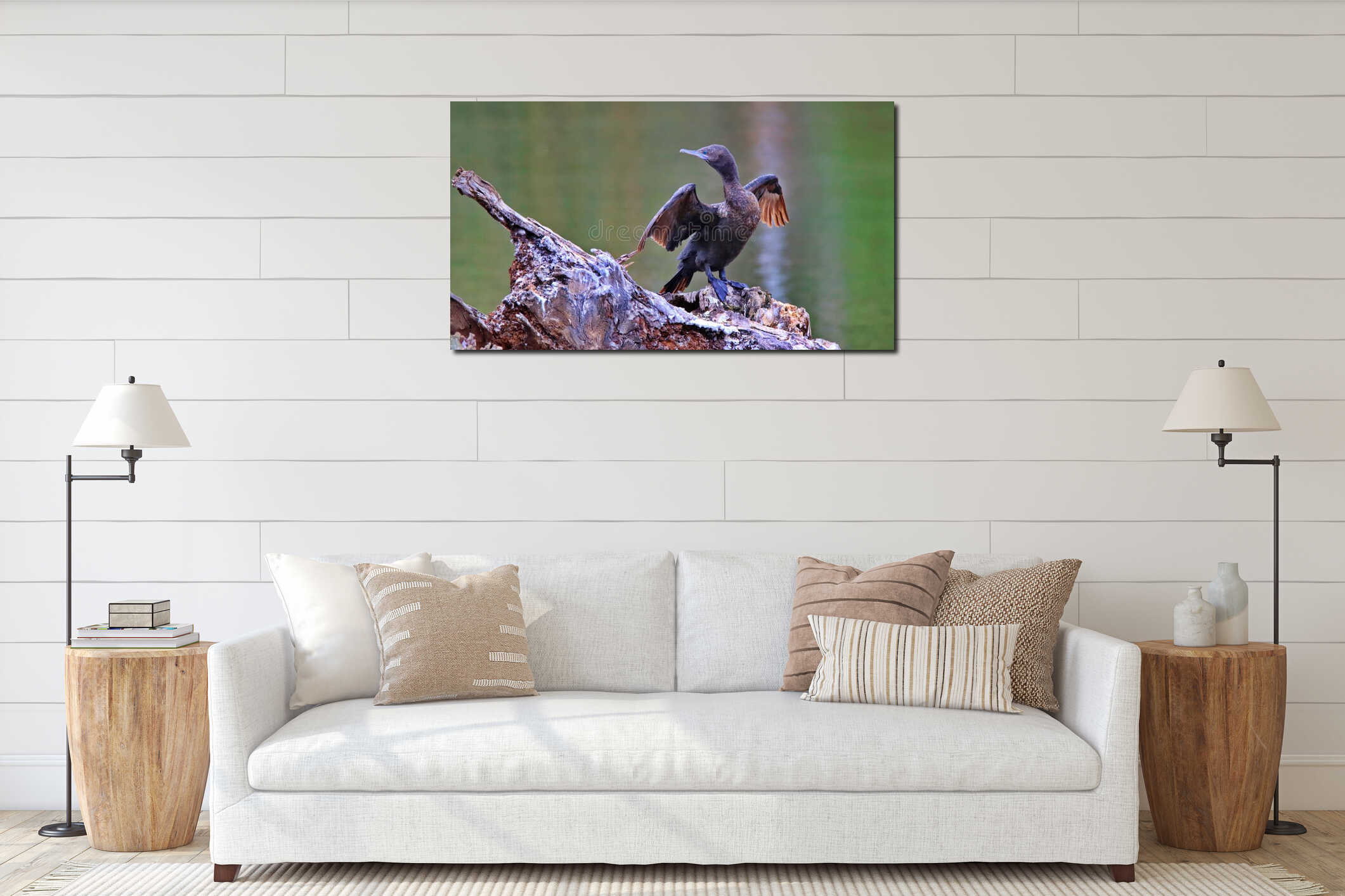 Cormorant perched on a log by a lake. interior mockup