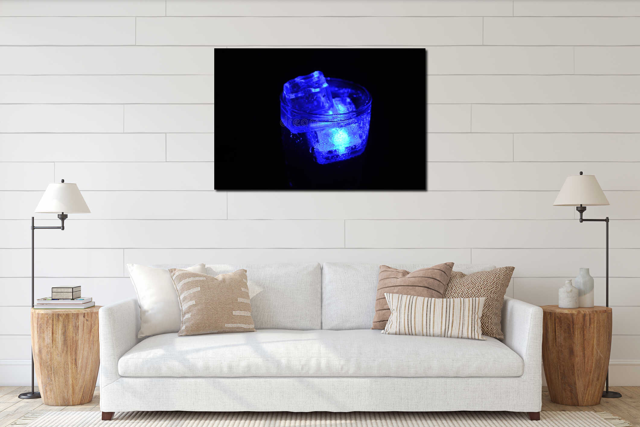 Beautiful and bright blue glowing ice cube floats in a glass champagne glass with a drink. interior mockup