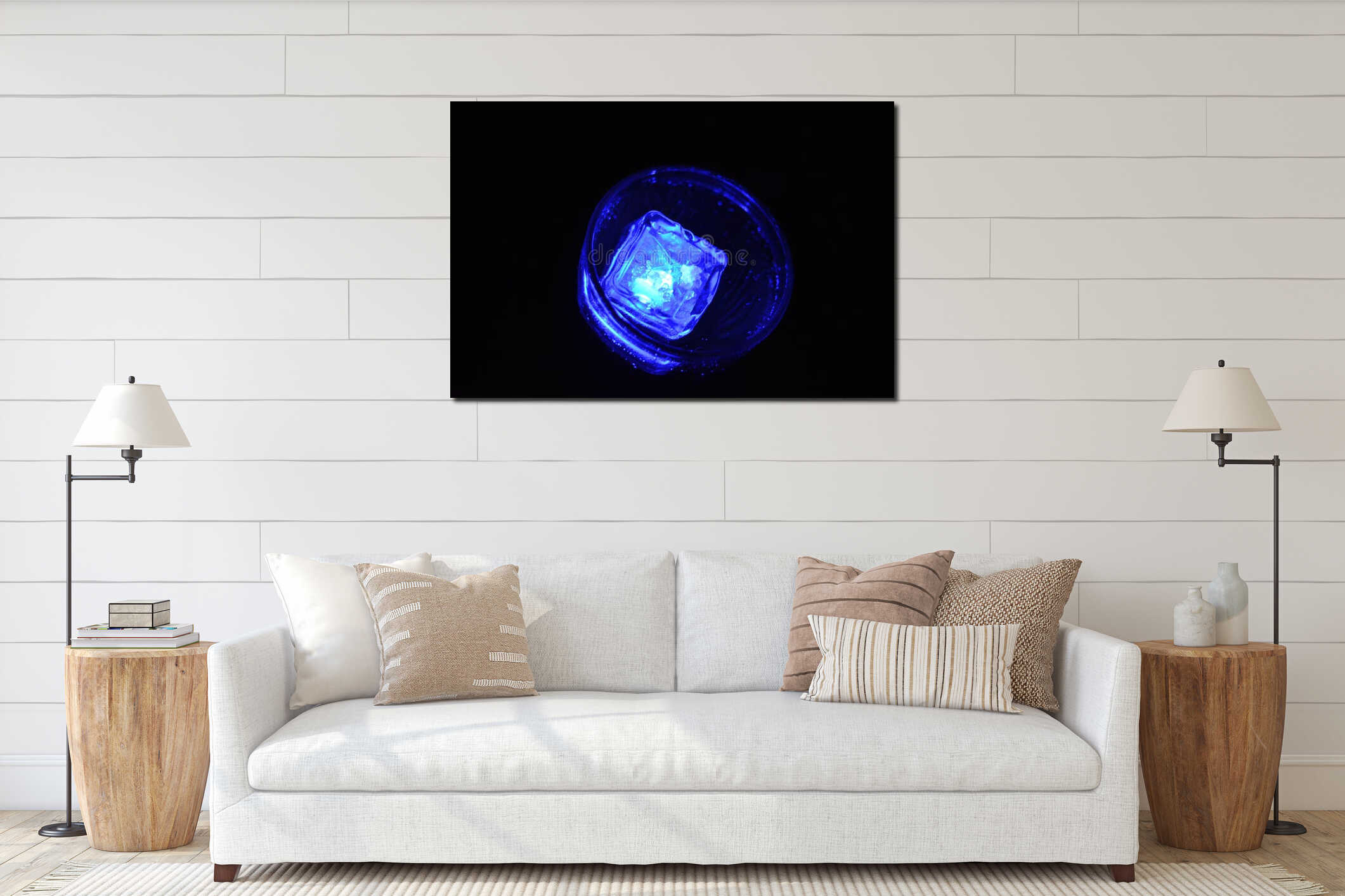 Beautiful and bright blue glowing ice cube floats in a glass champagne glass with a drink. interior mockup