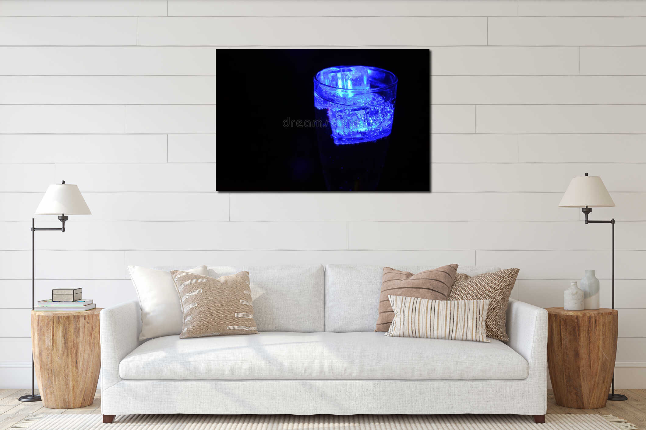 Beautiful and bright blue glowing ice cube floats in a glass champagne glass with a drink. interior mockup