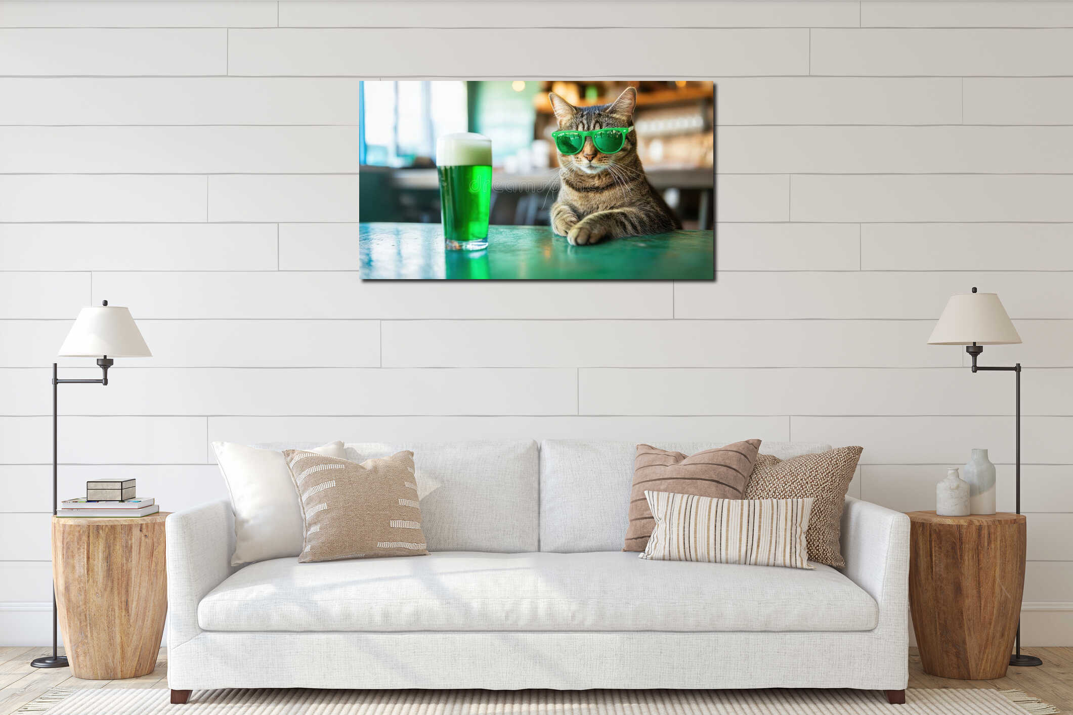 Tabby cat with sunglasses sitting by mug of green beer at bar counter. St. Patrickâs Day celebration interior mockup