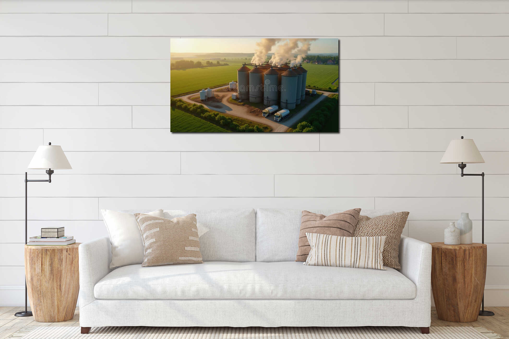 Tall grain silos stand prominently in a lush green landscape, bathed in golden sunset light. Trucks are parked nearby interior mockup