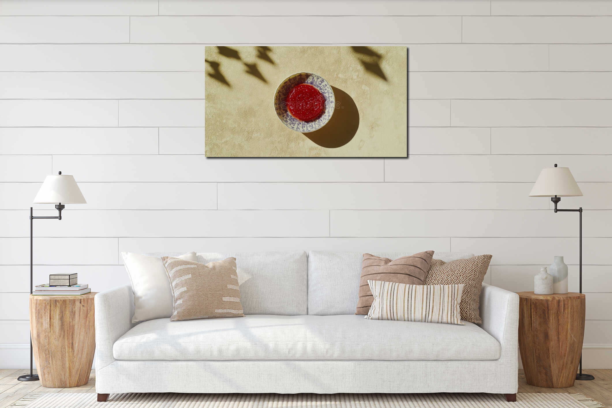A small, vividly red tomato sauce bowl, with a silky texture and intense color, is displayed against a neutral interior mockup