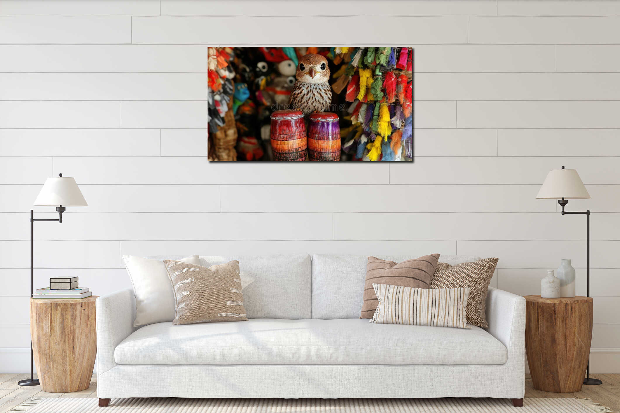 Small Brown Bird Perched on Colorful Drums Amidst Vibrant Textiles interior mockup
