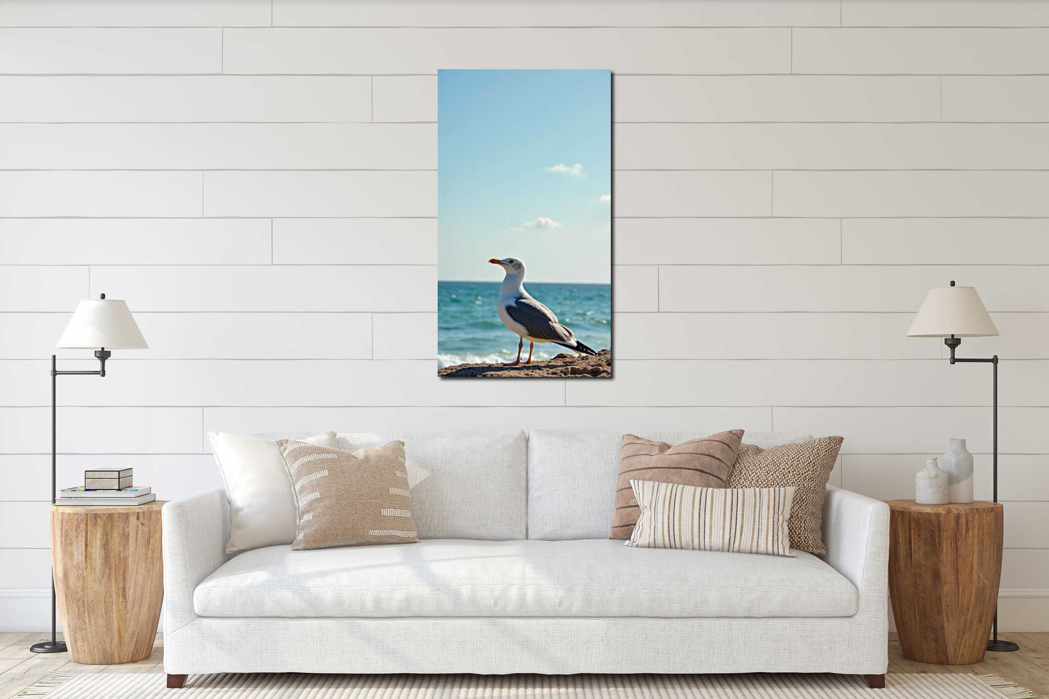 Seagull standing on a rocky beach with ocean waves and clear blue sky interior mockup