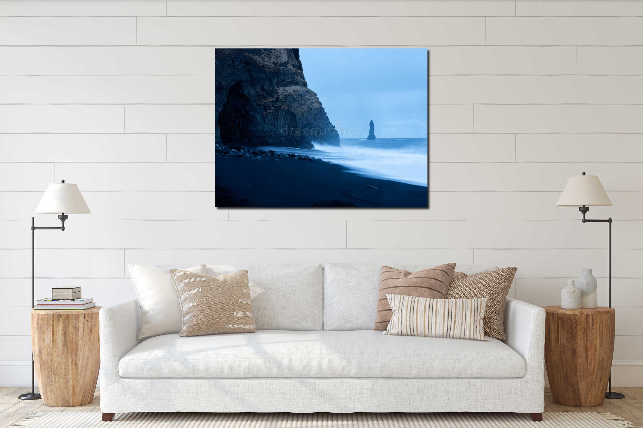 Reynisfjara Beach at twilight, featuring the iconic Reynisdrangar sea stack and basalt column cliffside, with foamy waves crashing interior mockup