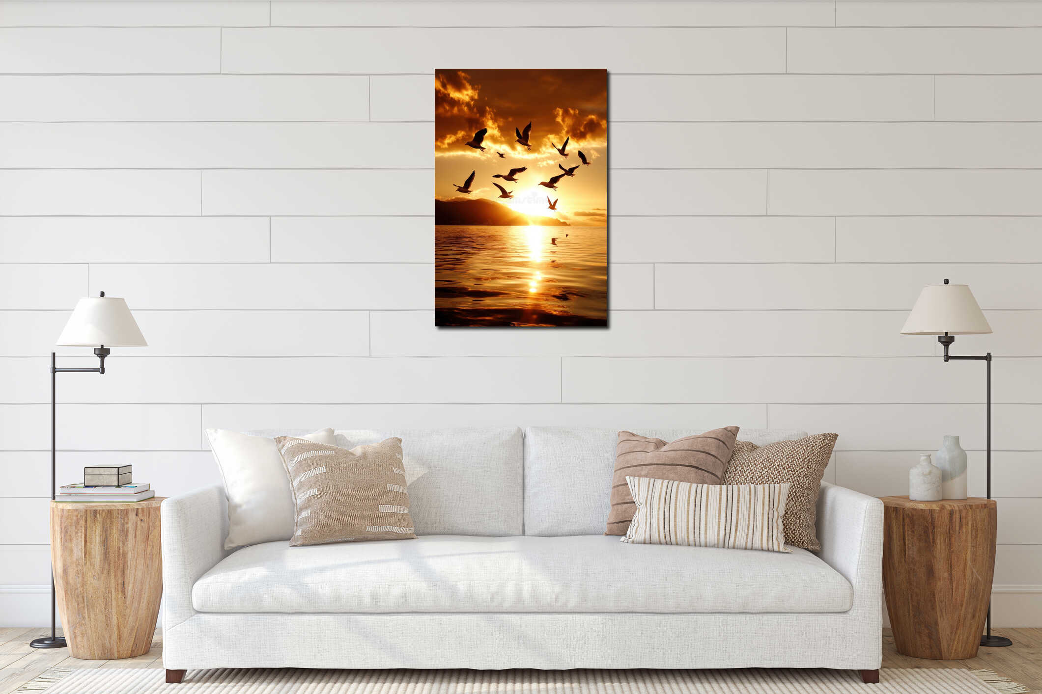 Flock of seabirds flying over ocean at vibrant golden sunset glow interior mockup