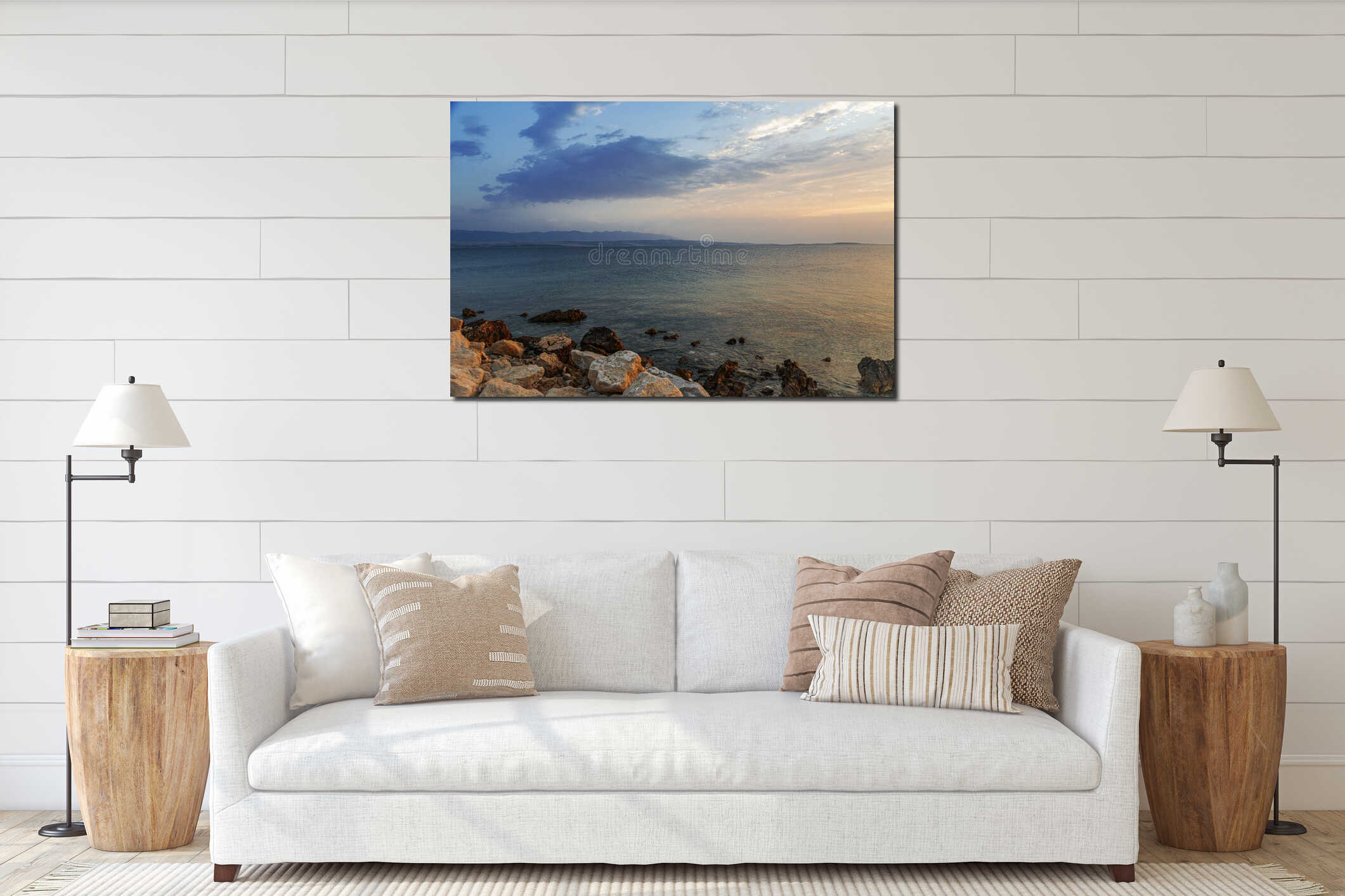 A peaceful rocky coastline stretches beneath a pastel-colored evening sky interior mockup