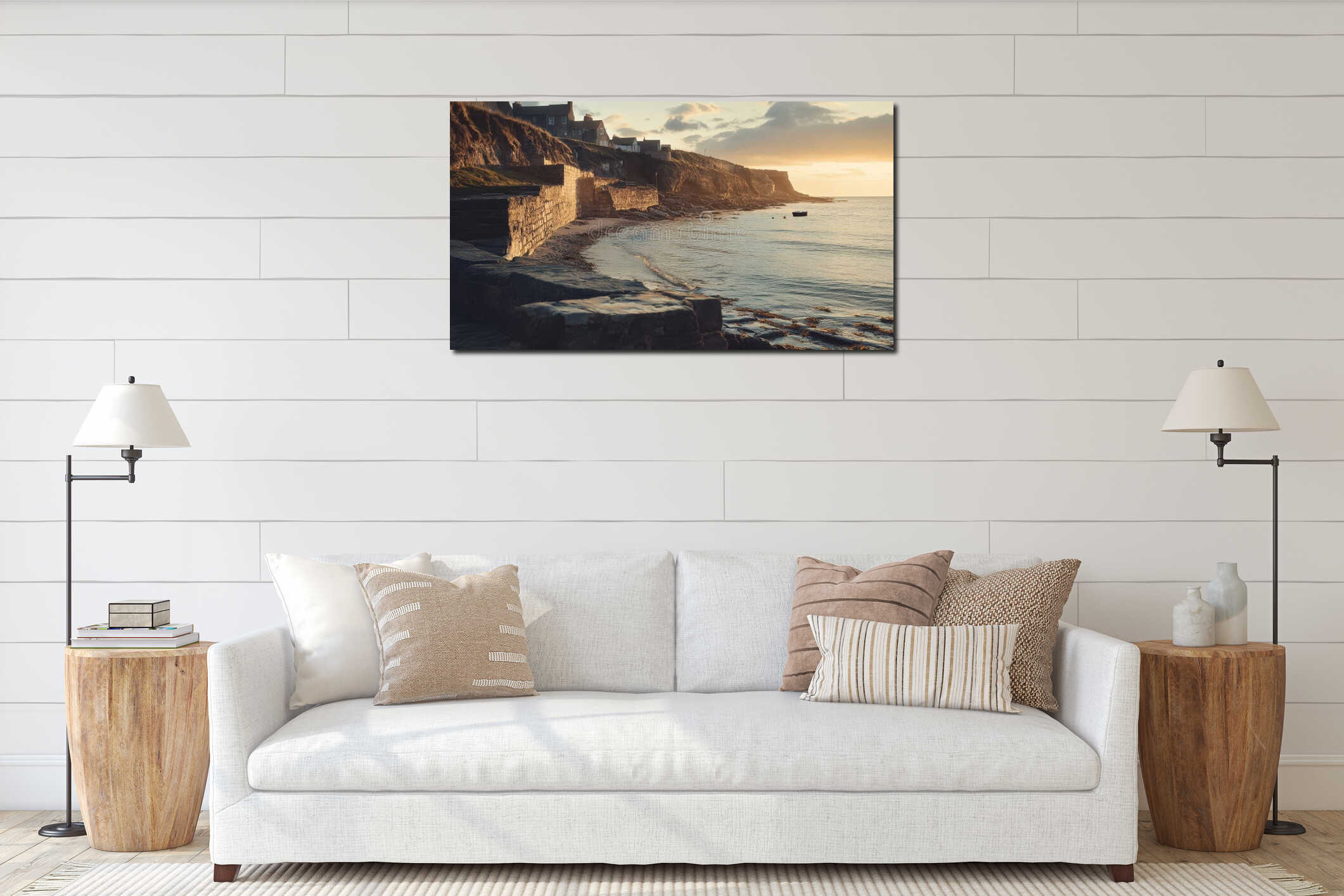Beautiful sunset over rocky coast, peaceful waves lapping at the shore, tranquil scene near a small village by the beach interior mockup