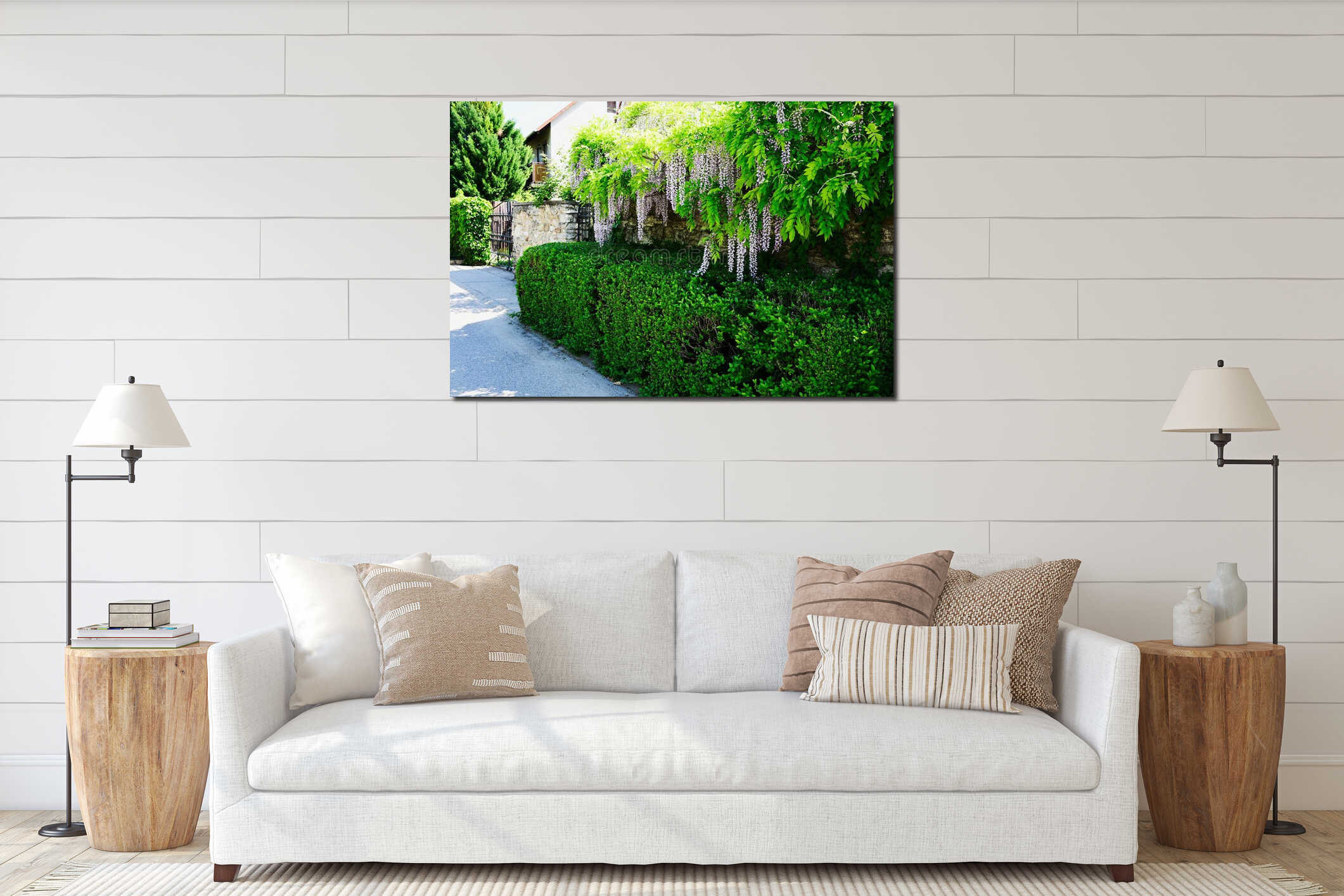 lush green hedge and stone fence. hanging blooming purple acacia flowers and leaves. forged black iron picket gate interior mockup