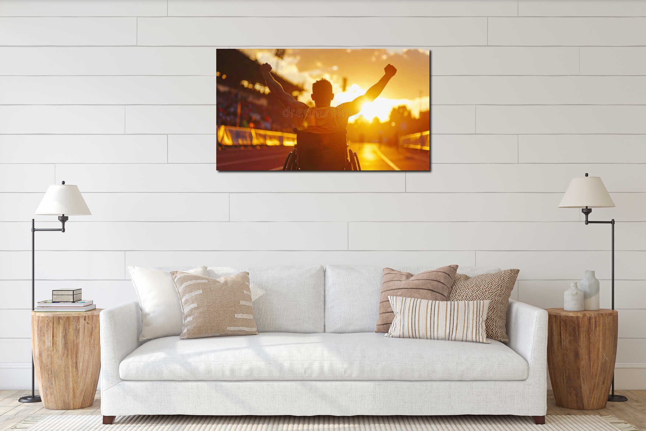 A victorious male athlete in a wheelchair celebrating on a track field during sunset representing resilience interior mockup