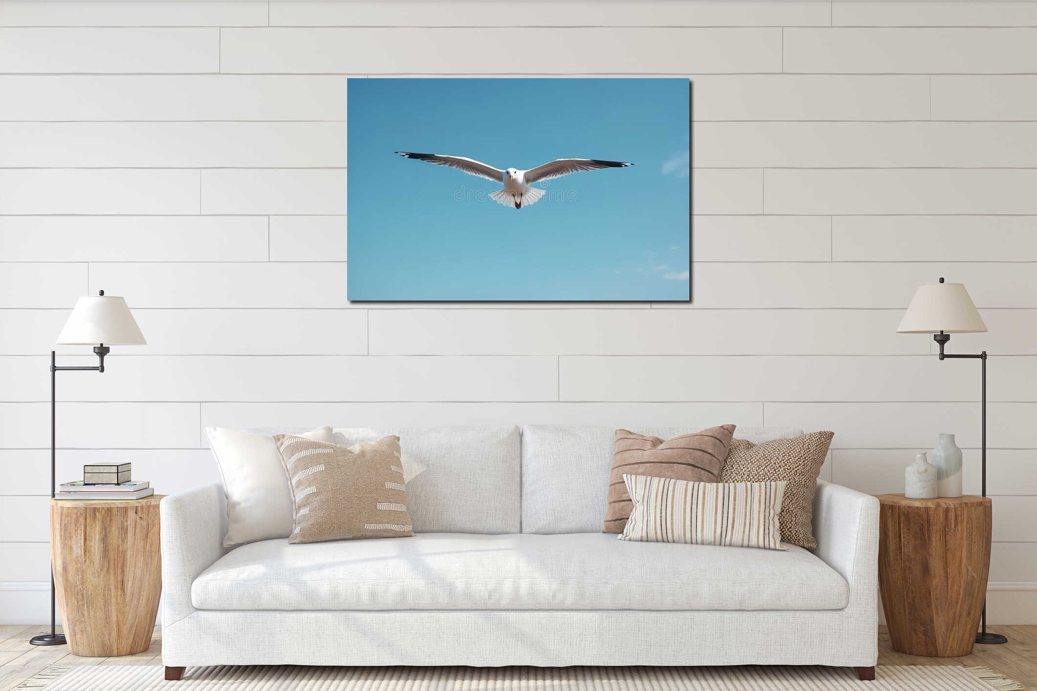 Seagull flying against bright blue sky. White bird spreads wings soaring. Sea bird in flight in natural environment. Wildlife interior mockup