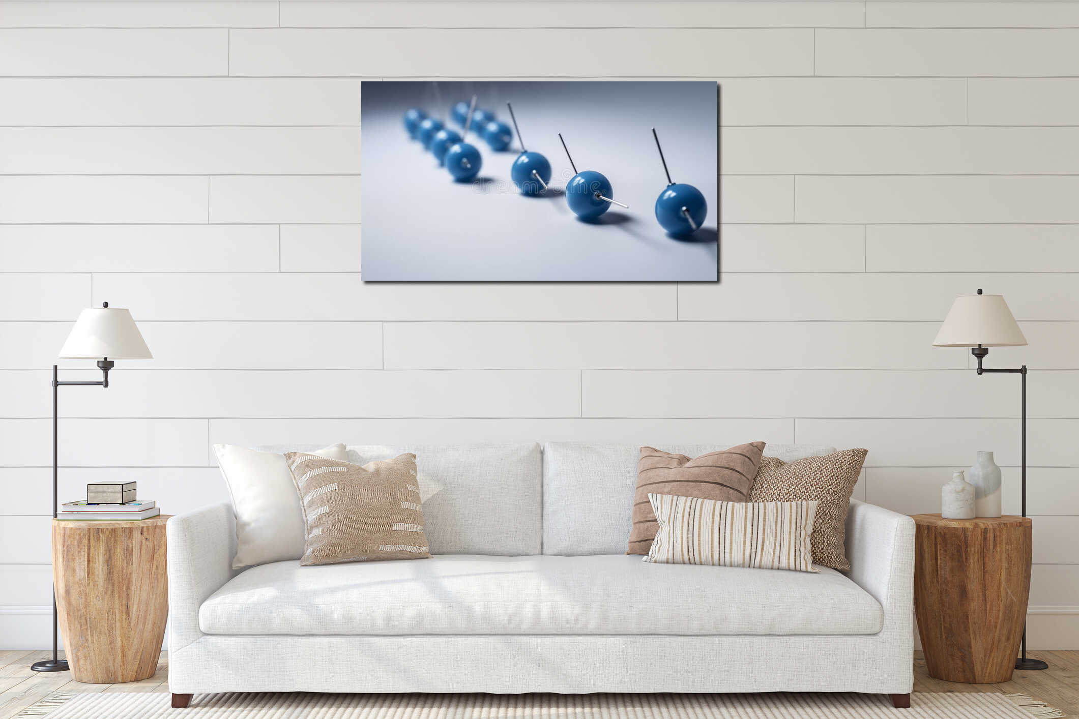 A row of blue spheres with pins pointing upwards on a white surface close up interior mockup