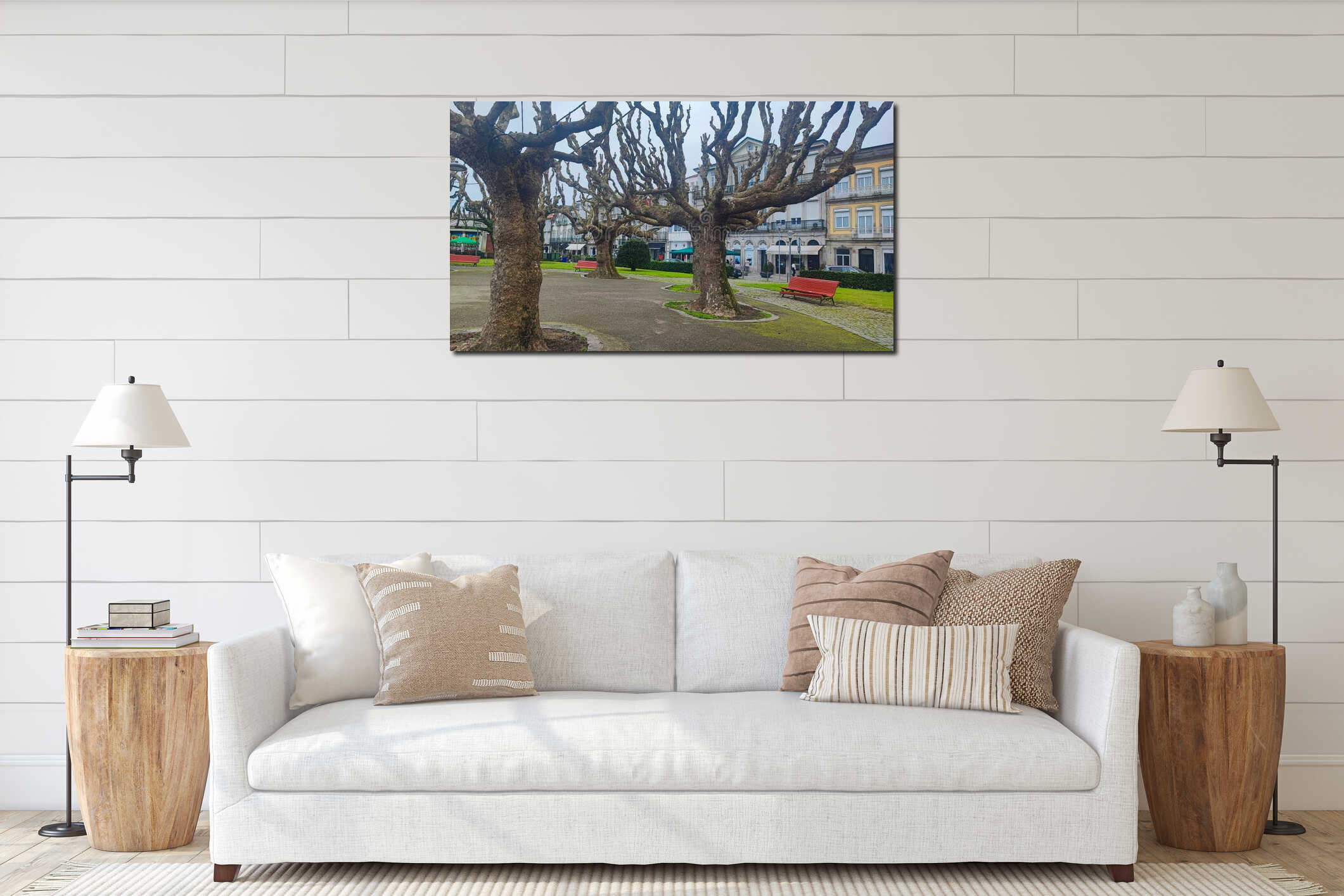 A peaceful waterfront with red benches under moss-covered trees, overlooking the pier in the town of Viana do Castelo in Portugal interior mockup