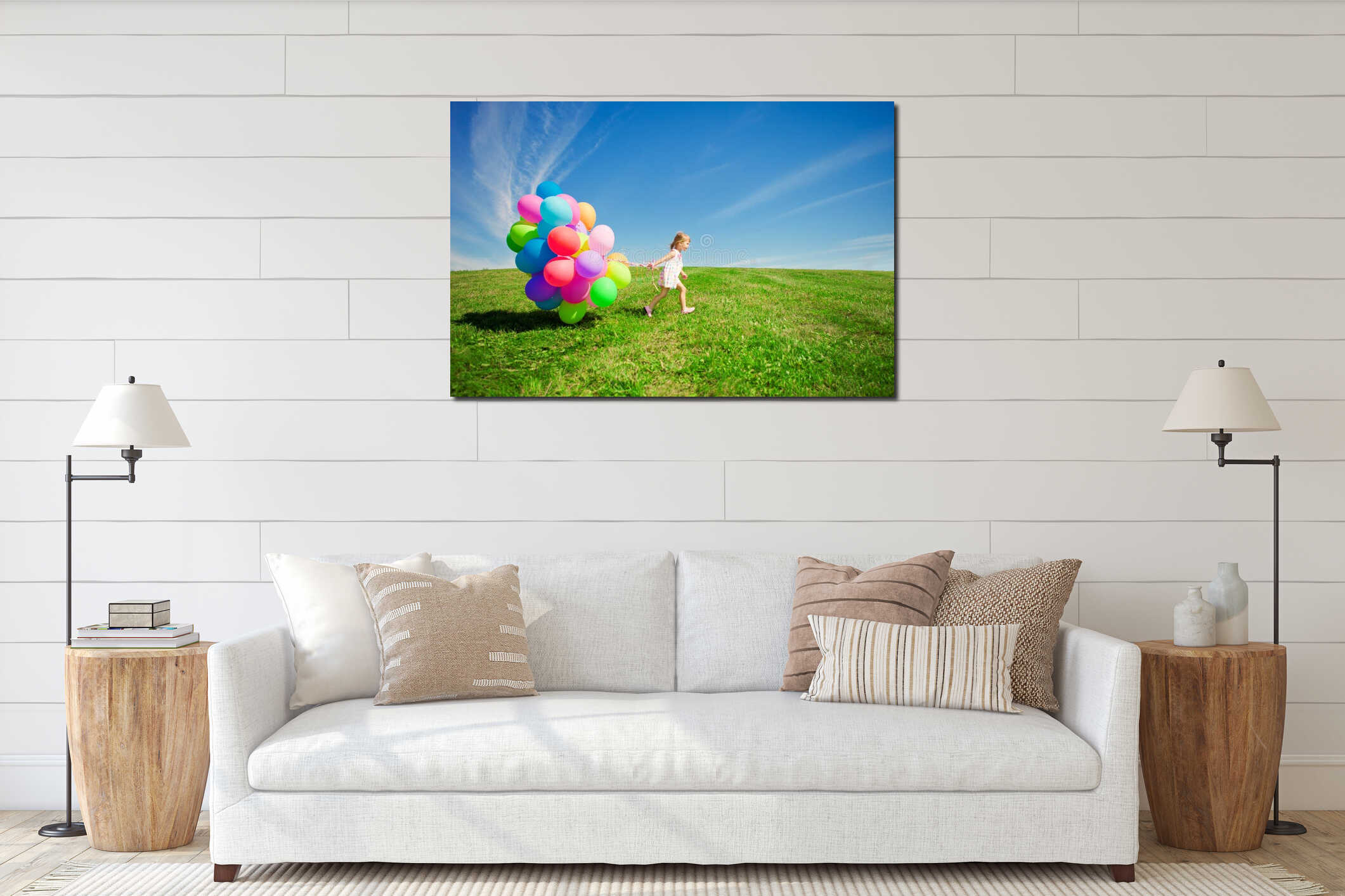 Little girl holding colorful balloons. Child playing on a green interior mockup