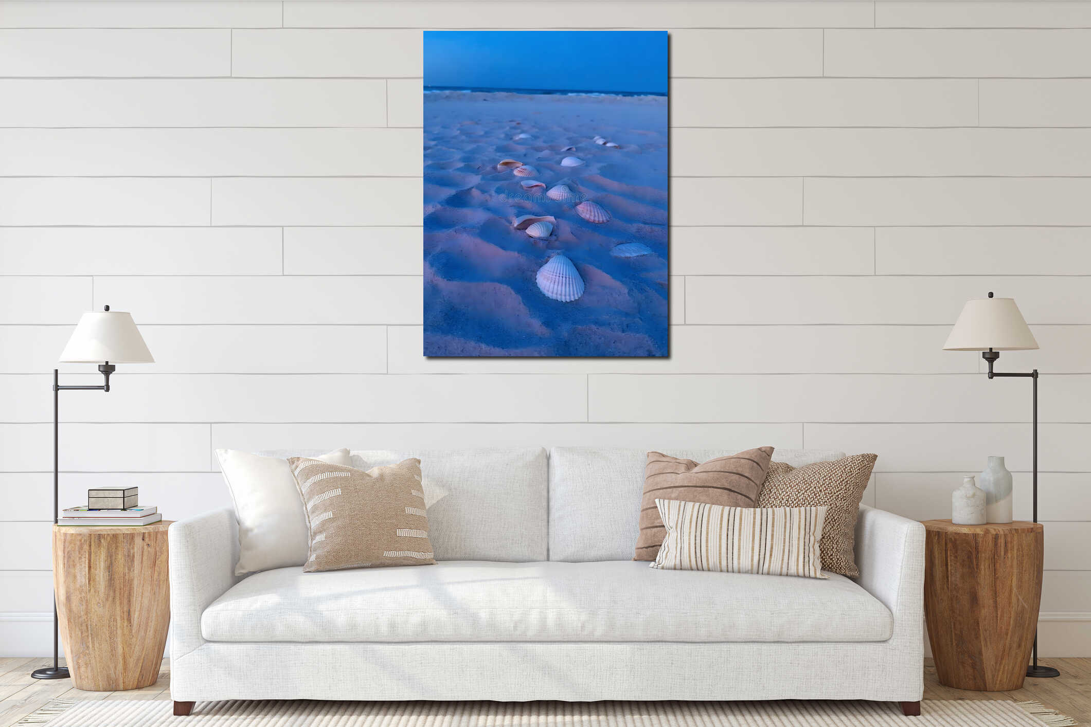 Seashells scattered on sandy beach during twilight under deep blue sky horizon. interior mockup