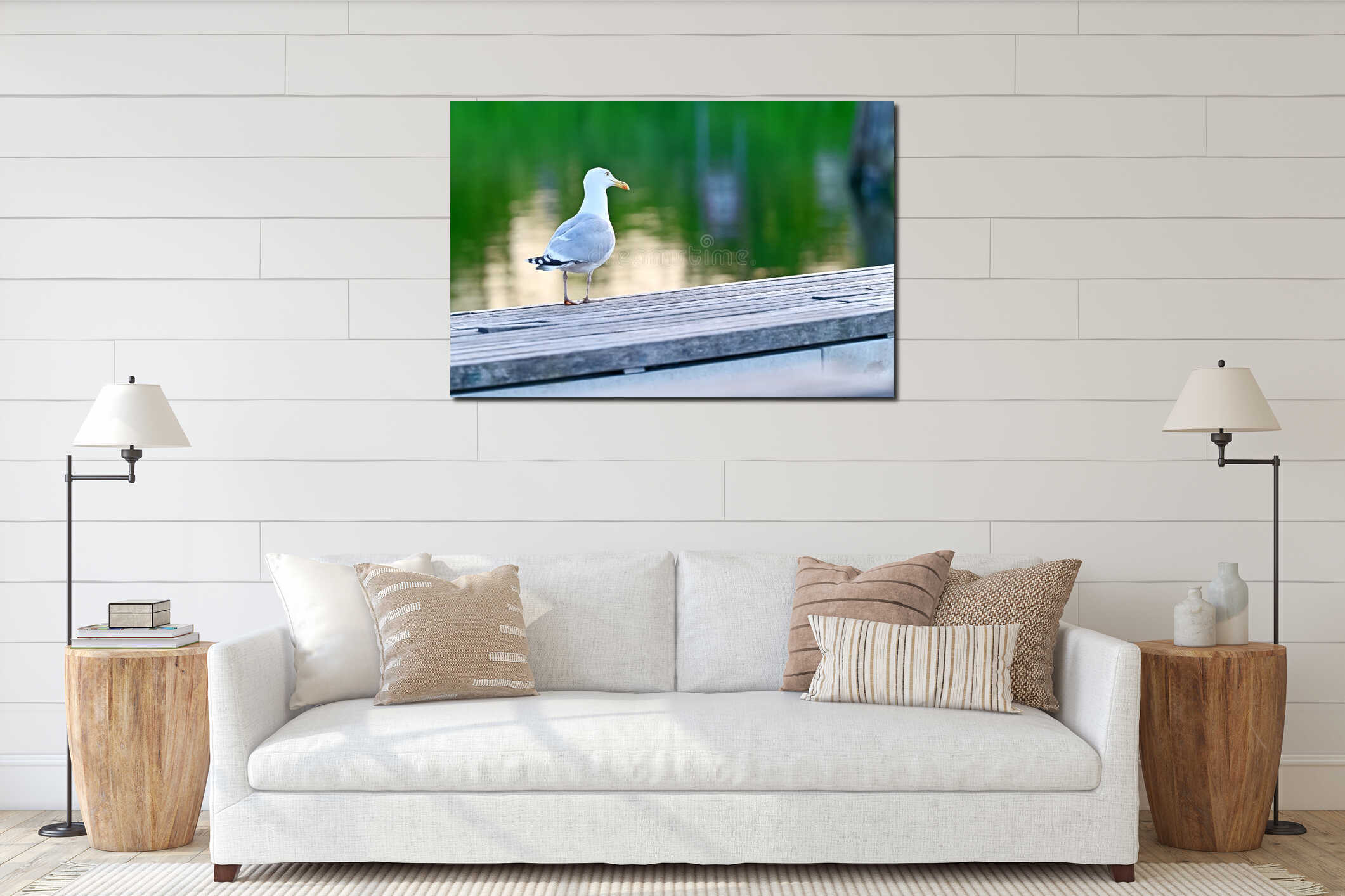 Large seagull resting on wooden bench surface beside reflective water interior mockup