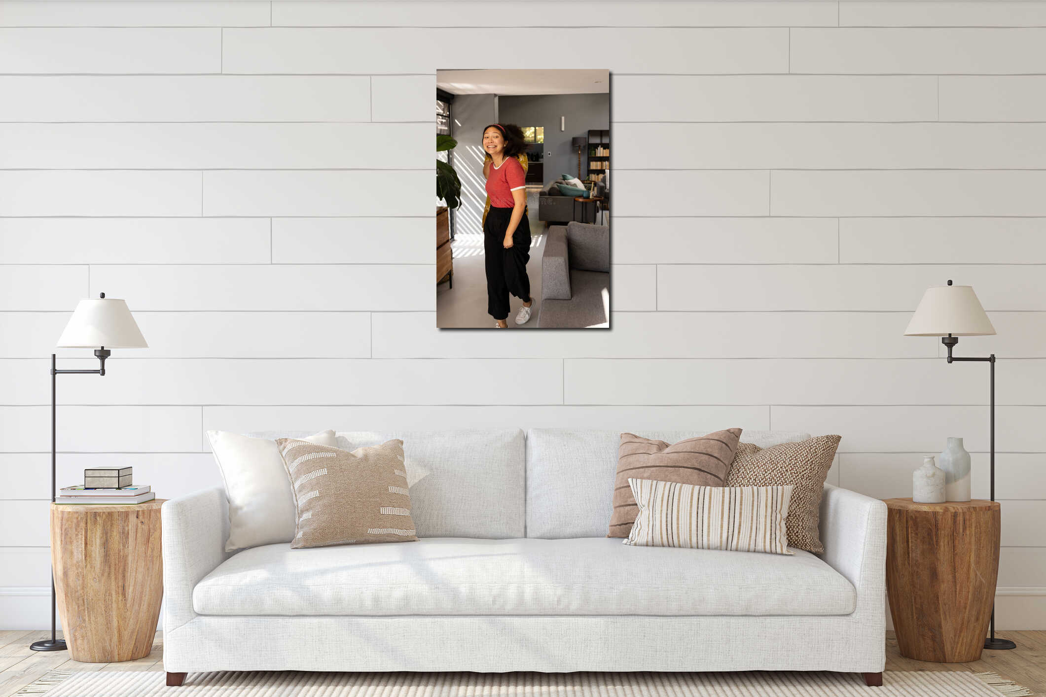 Smiling woman in red shirt dancing joyfully in modern living room interior mockup