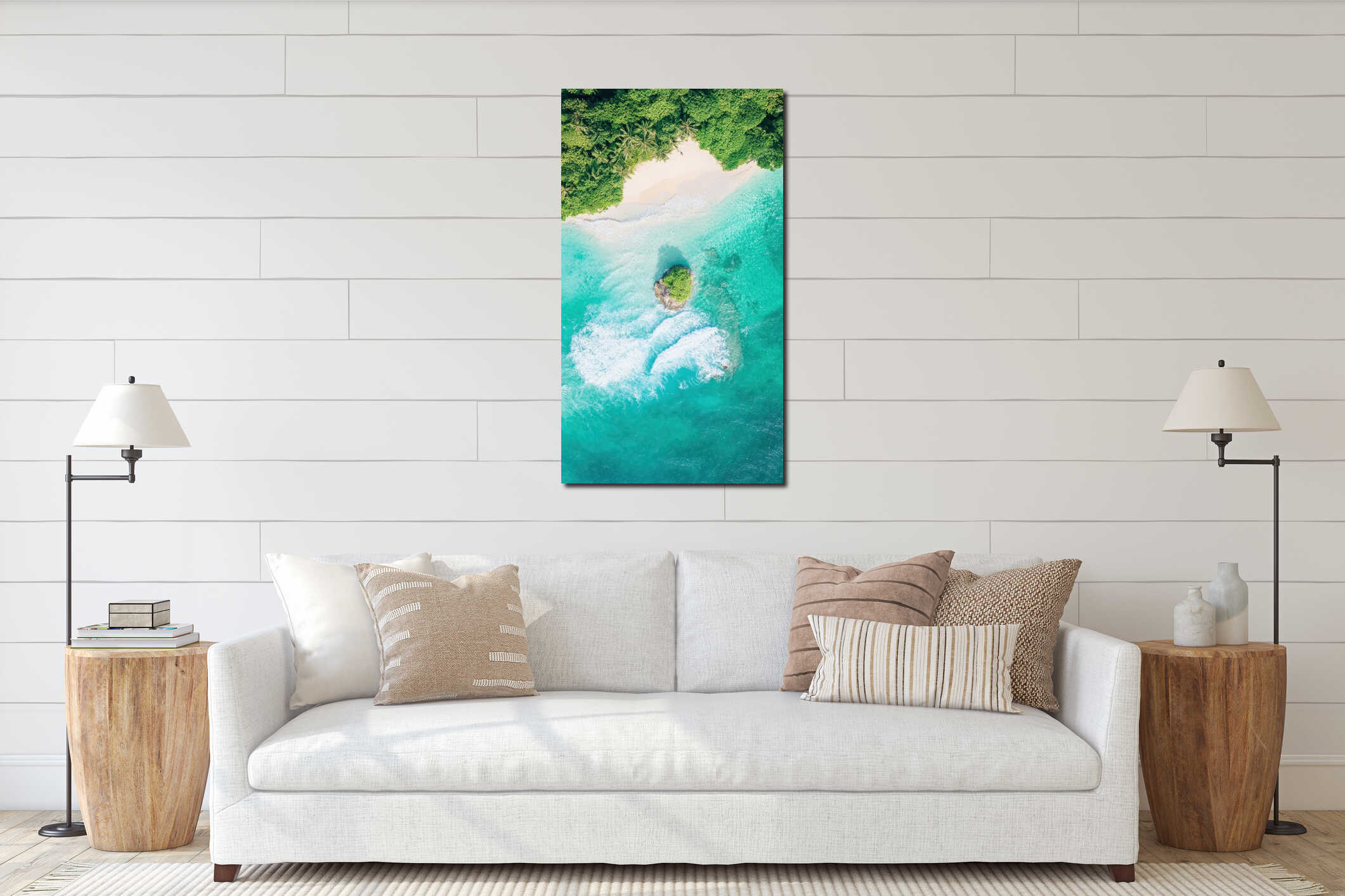 Aerial view of a tropical island with white sand beach meets green forest and blue ocean waves crashing over small rocky island. interior mockup