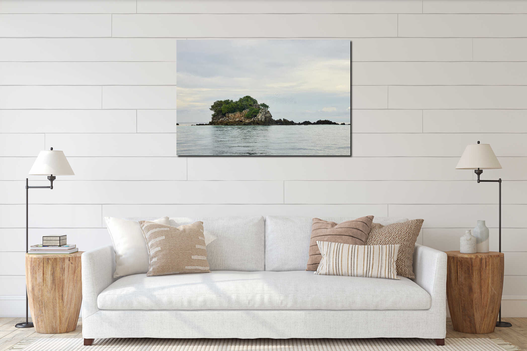 Tranquil small rocky island with lush greenery in calm ocean waters under interior mockup