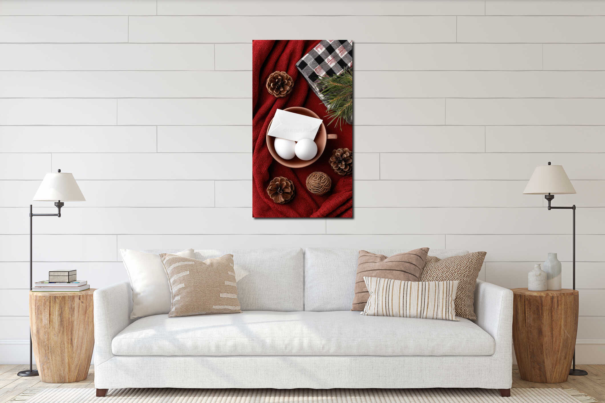 Bright red card rests on a smooth surface with green pine branches and shiny ornaments, creating a holiday atmosphere of interior mockup