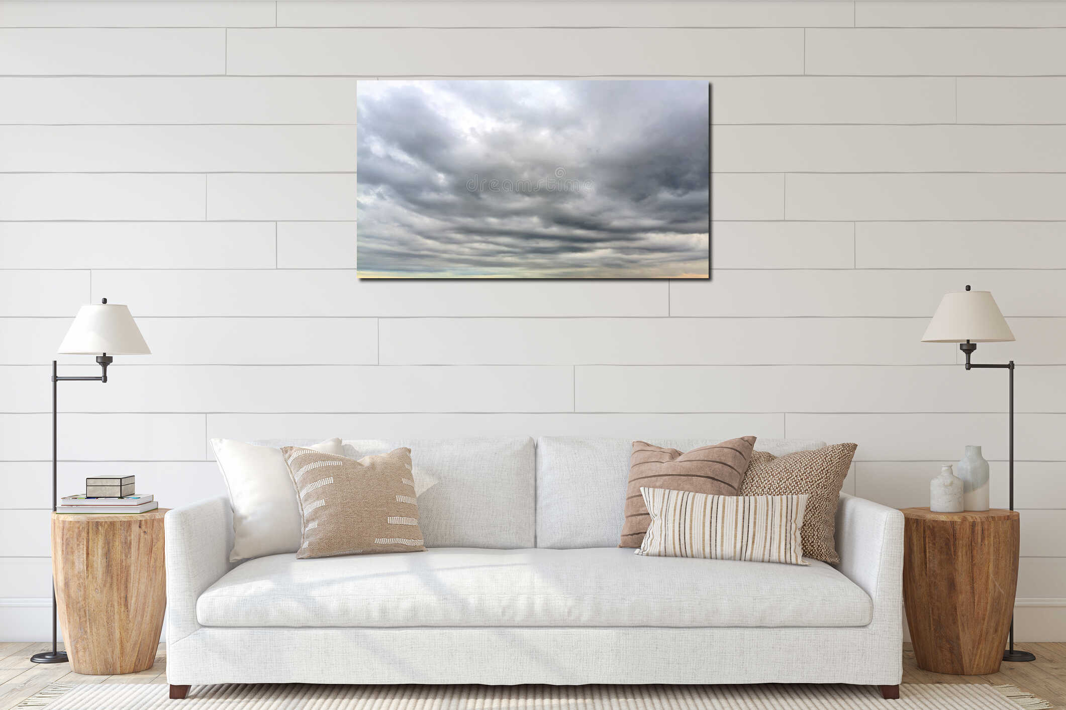Dramatic cloudy sky with soft golden sunlight breaking through layers of thick evening clouds interior mockup