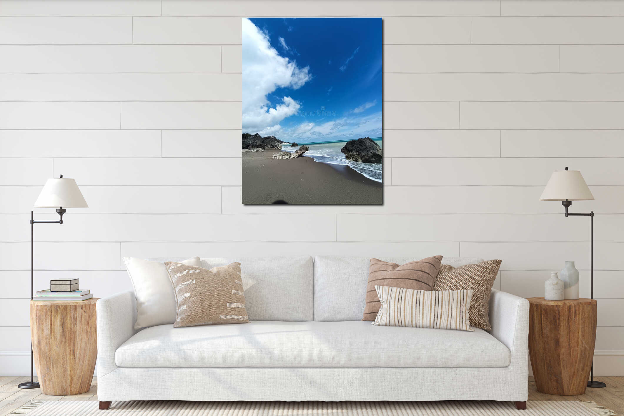 Tranquil tropical beach with clear sky and ocean waves hitting rocks interior mockup
