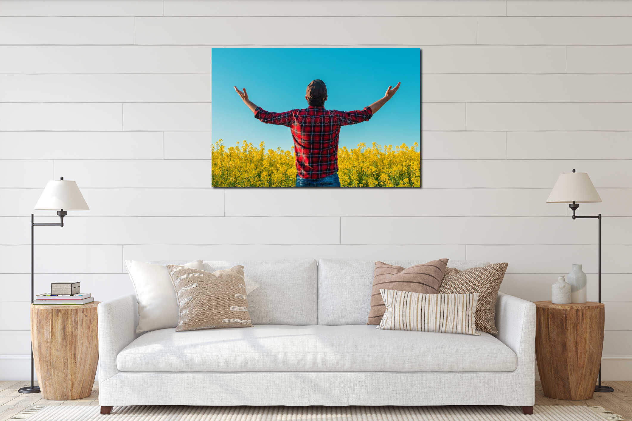 Successful male farmer with hands raised in cultivated rapeseed field interior mockup