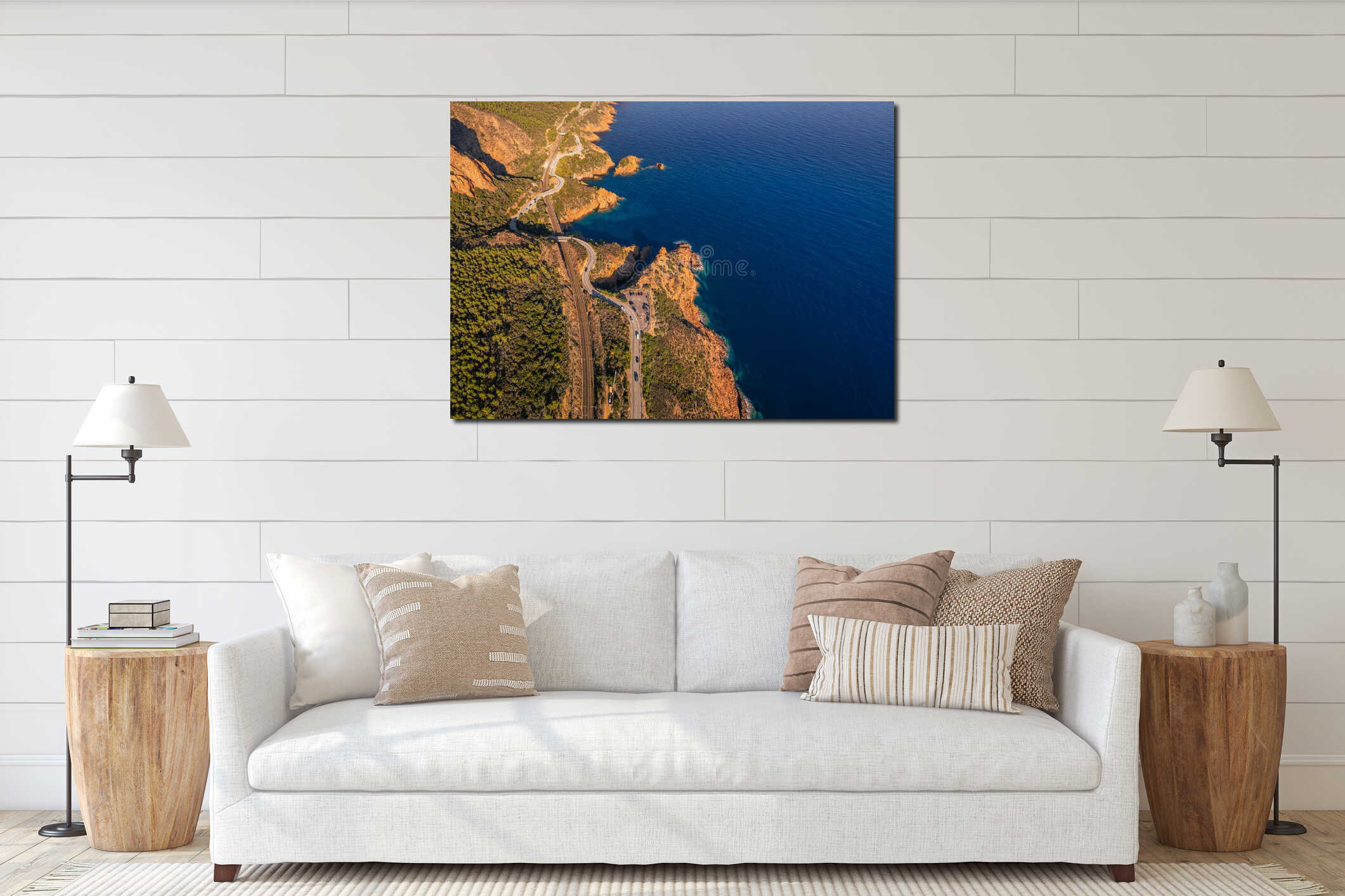 Aerial view of Esterel Mountains and winding coastal road above the blue Mediterranean Sea, interior mockup
