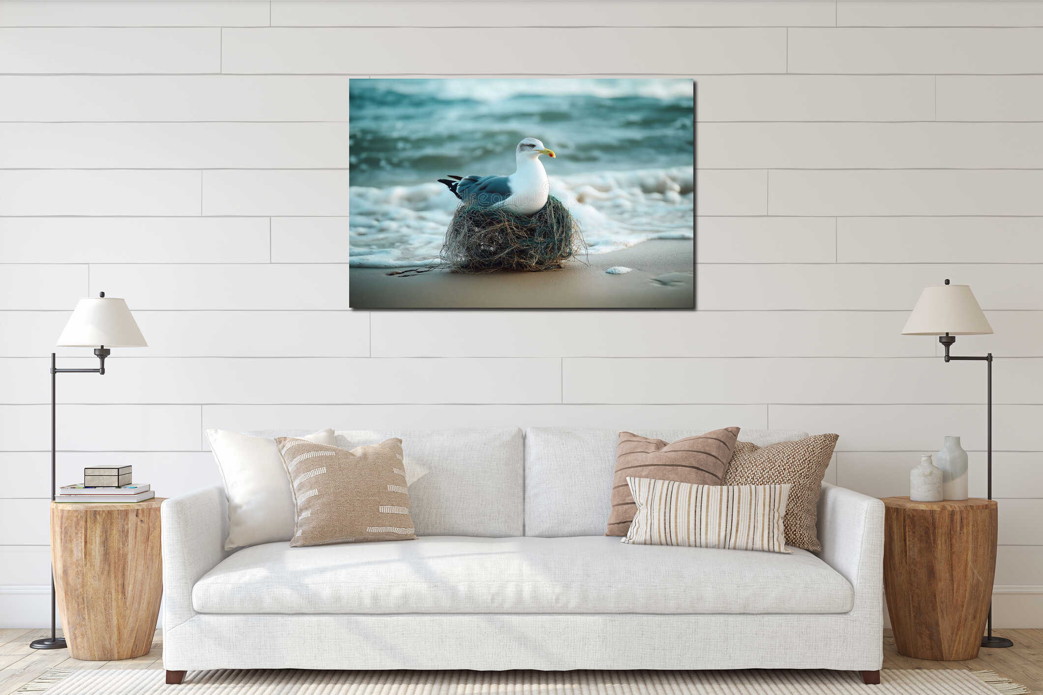 Seagull sitting in a nest made of fishing net on a sandy beach with ocean waves in the background interior mockup